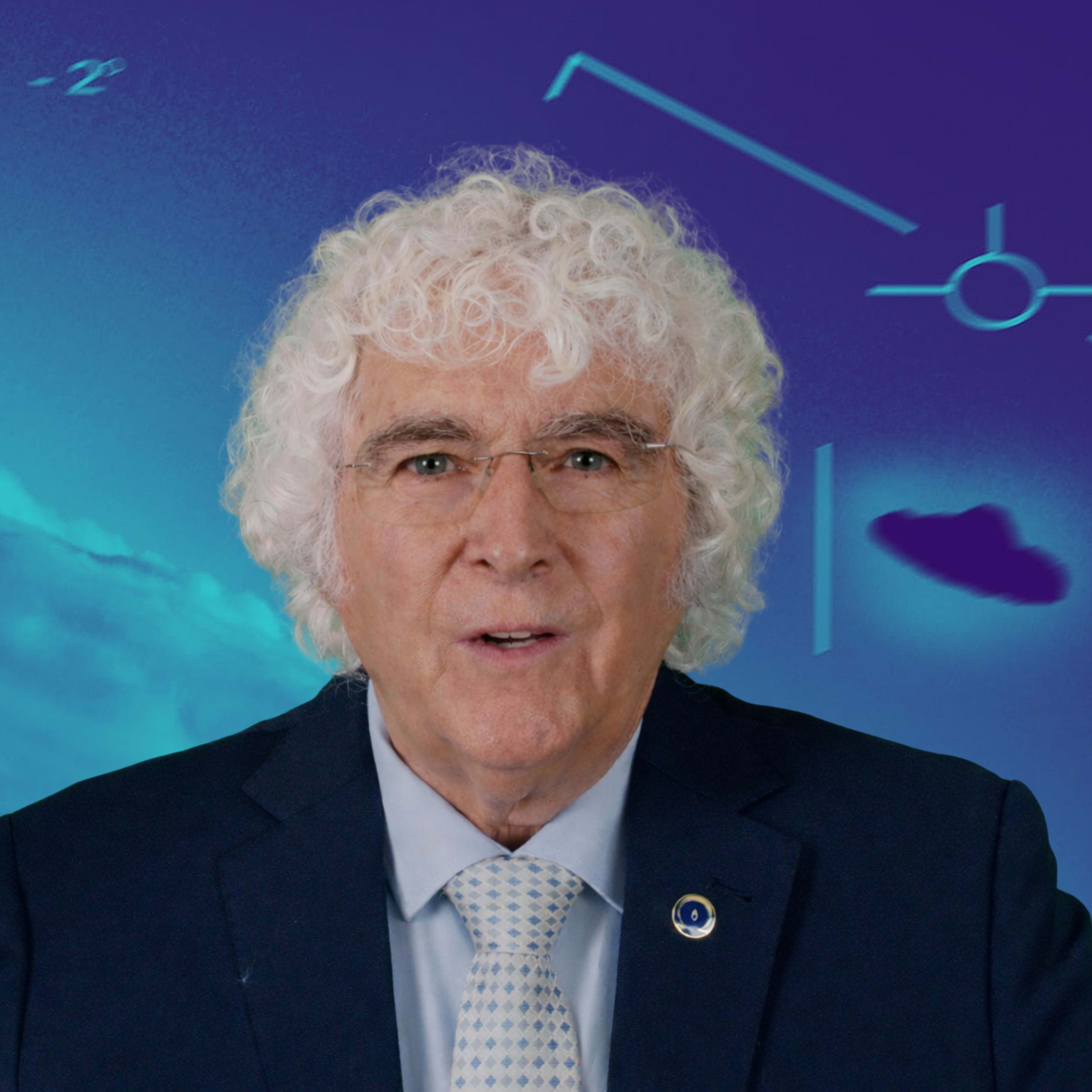 A man with curly white hair wearing a suit stands in front of a blue background featuring abstract shapes and a cloud-like formation.