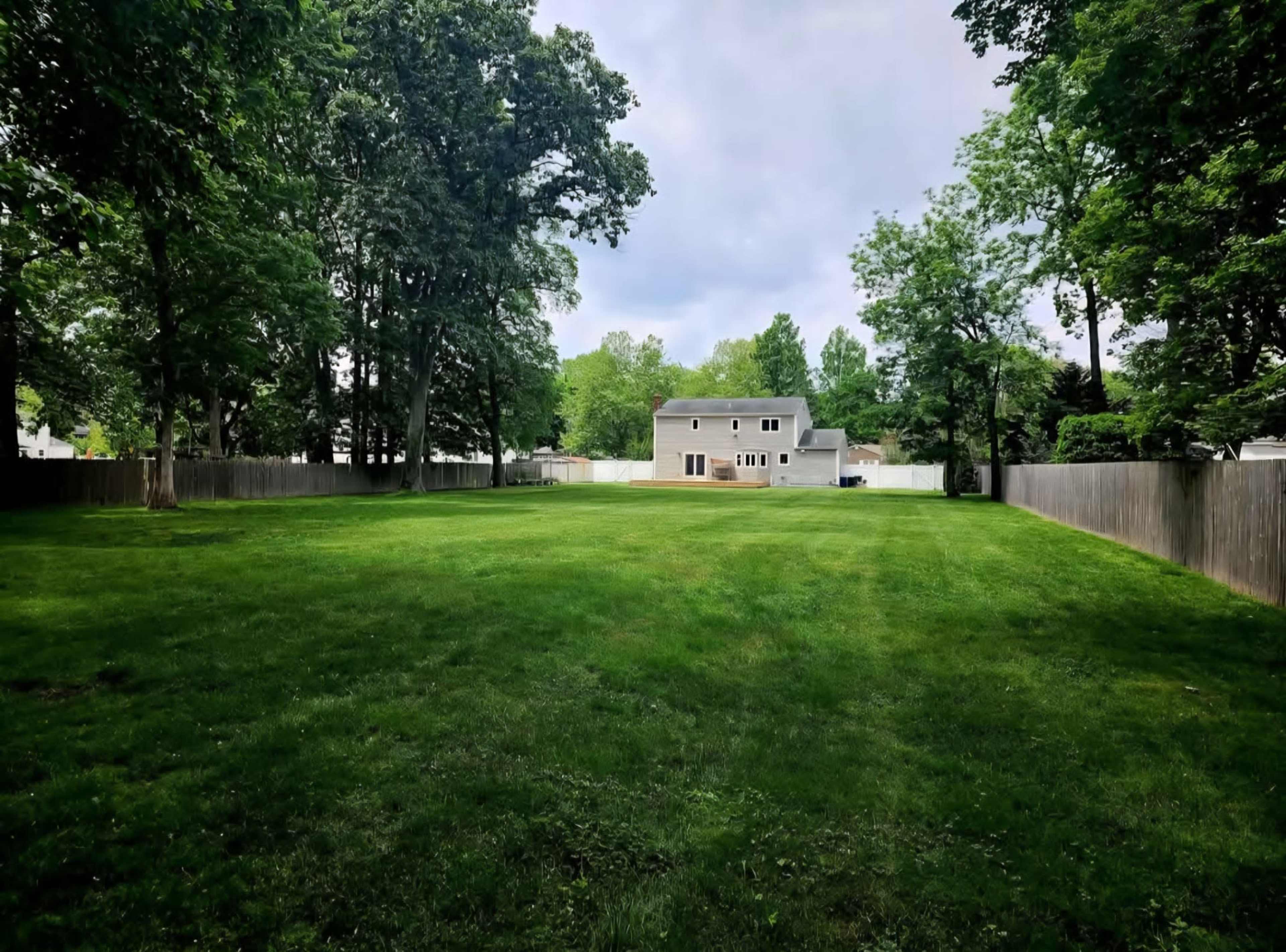 Elegant Backyard Escape with Ambient Lighting with Stage Image in Babylon, Wheatley Heights, NY