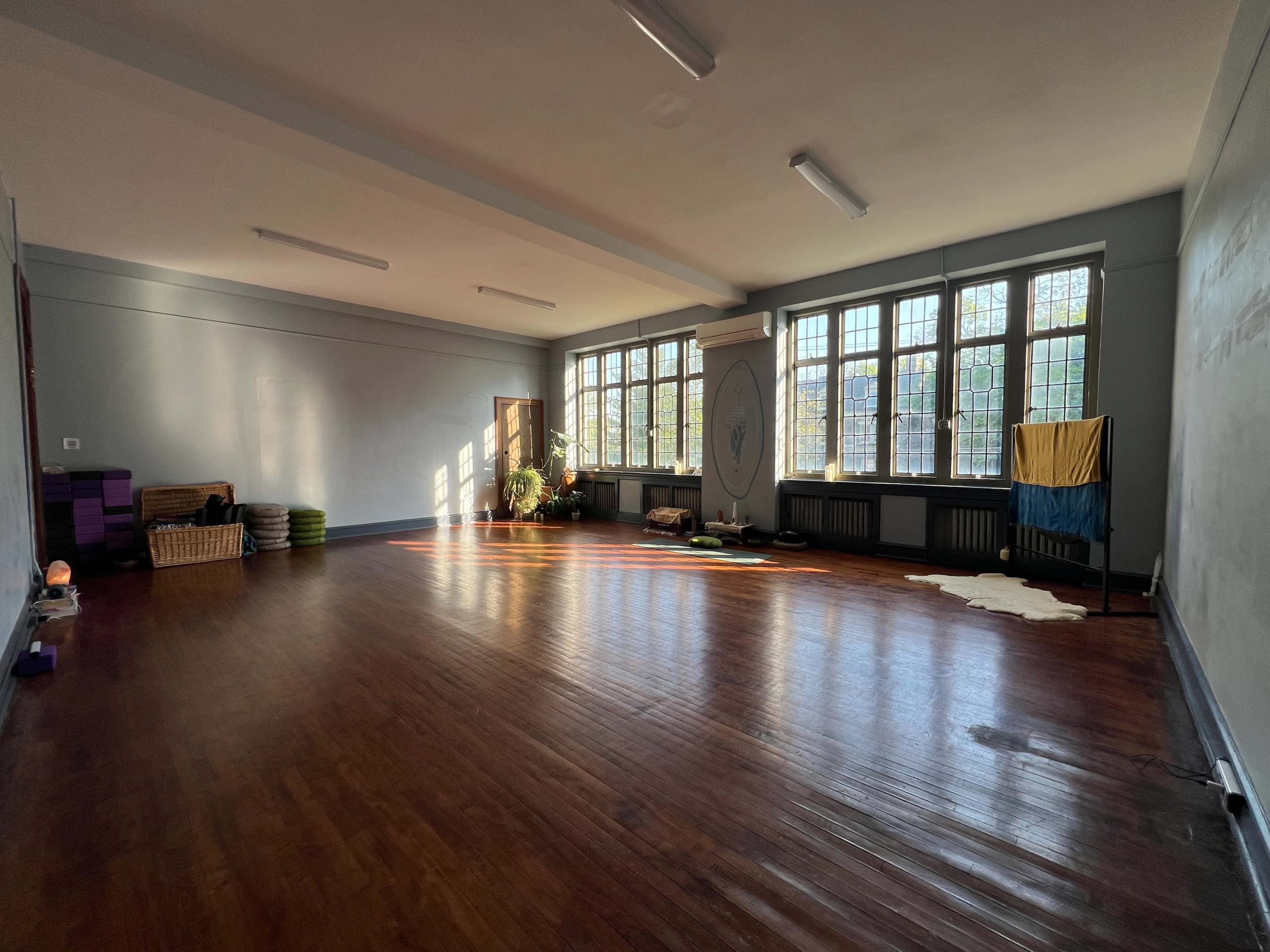 Sunlit Church Yoga Studio with Beautiful Sanctuary Windows Image in Mount Airy, Philadelphia, PA