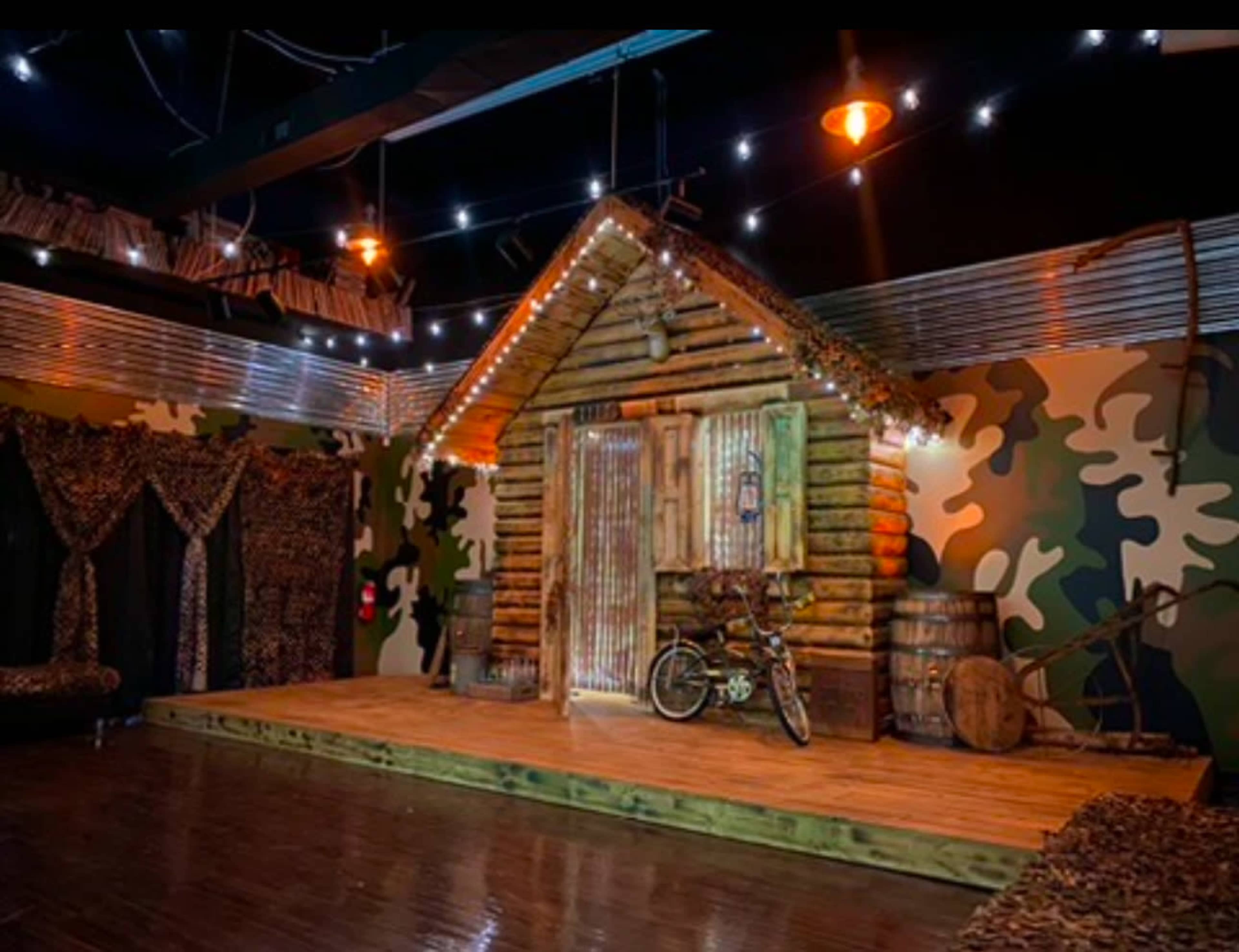 Indoor/Outdoor Ambience, prop log cabin with porch/stage, venue Image in Winston-Salem, Winston-Salem, NC