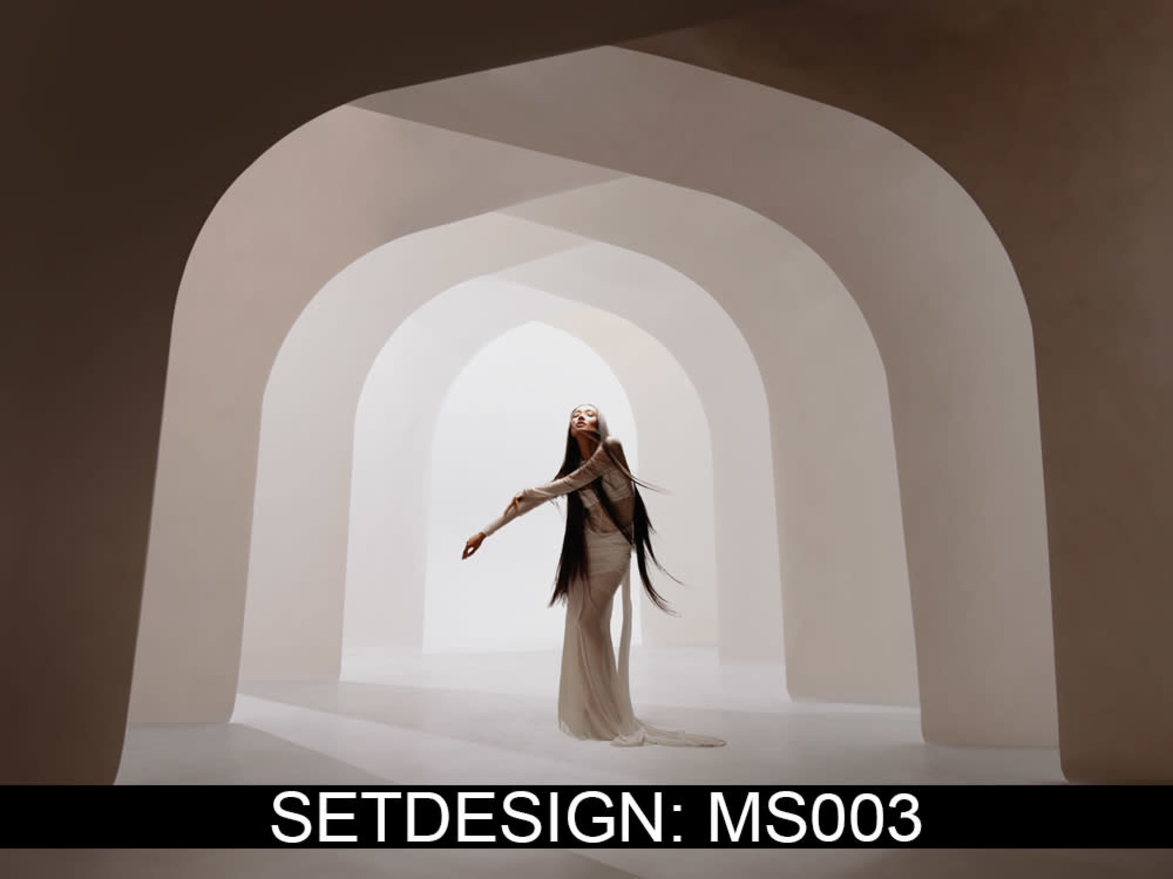 A person with long hair is standing in a minimalist arched architectural space with soft lighting.