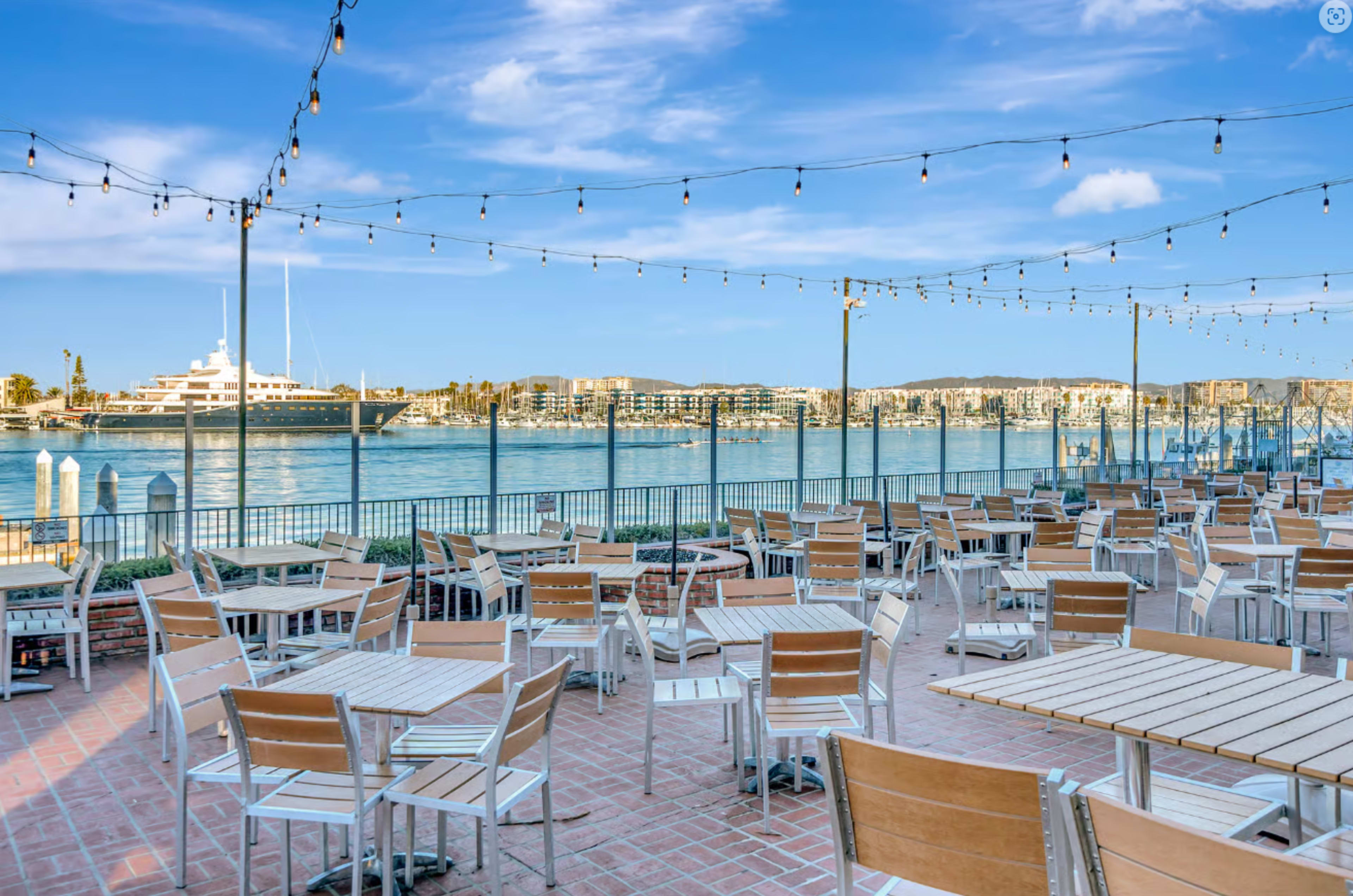Waterfront Restaurant with Expansive Patio Featuring Views of Sparkling Water, Yachts, and Sealife Image in Marina del Rey, Marina Del Rey, CA