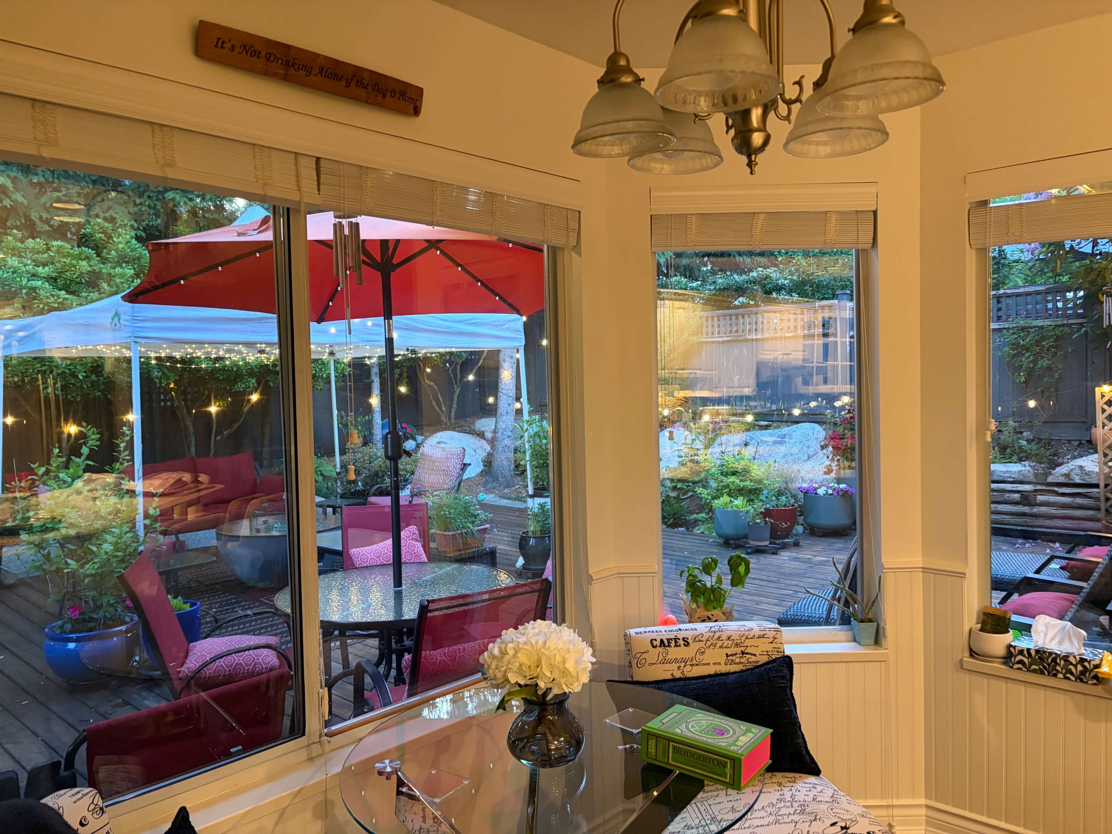 Cozy entertaining home with an outdoor 900 sq foot deck against lush trees and flowers. Image in Westwood Plateau, Coquitlam, BC