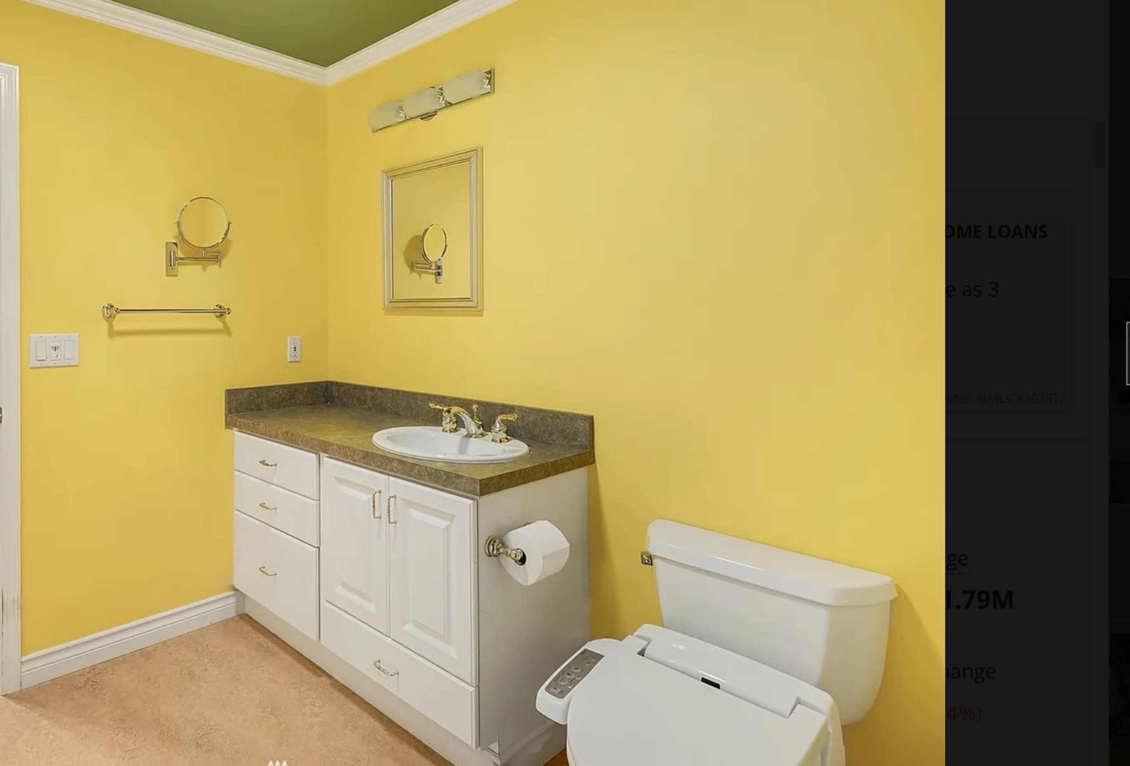 The bathroom features yellow walls, a light-colored vanity with a sink, and a white toilet.