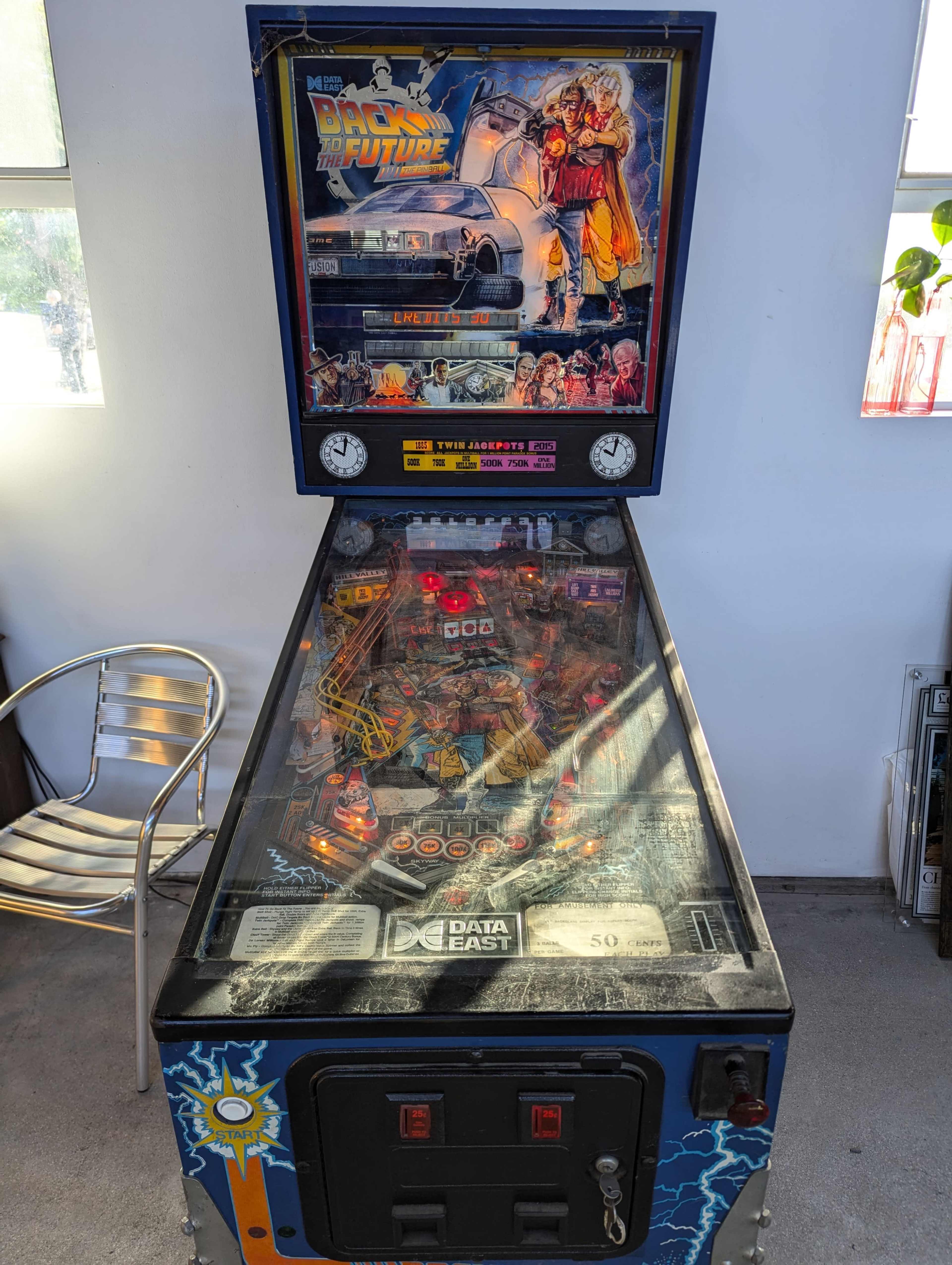 A "Back to the Future" themed pinball machine with a colorful playfield and illuminated features.