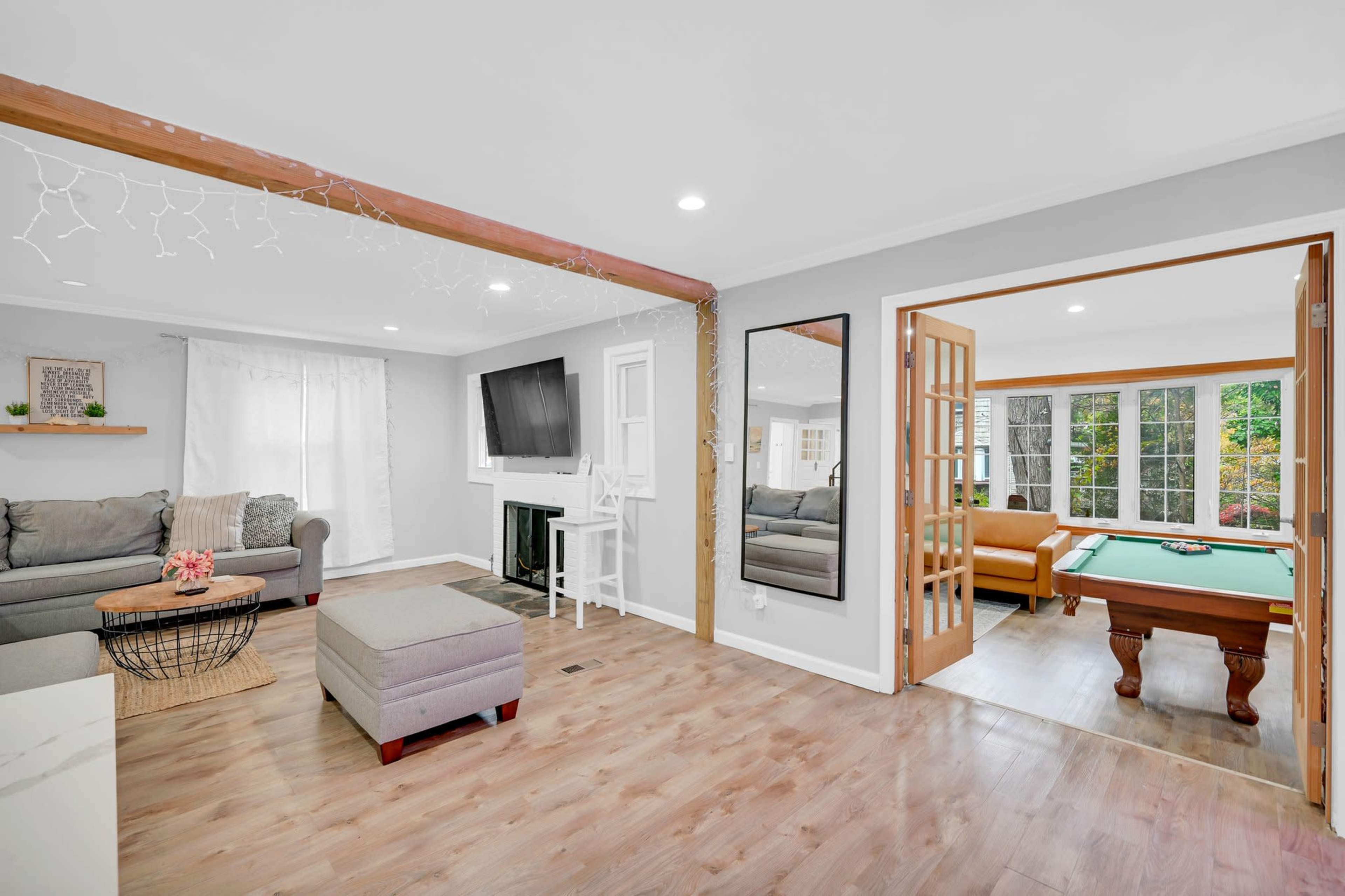 Modern Open Concept Entire single family home with basketball court and full deck in the back yard. Small creek runs as well on side of property. Image in Englewood, Englewood, NJ