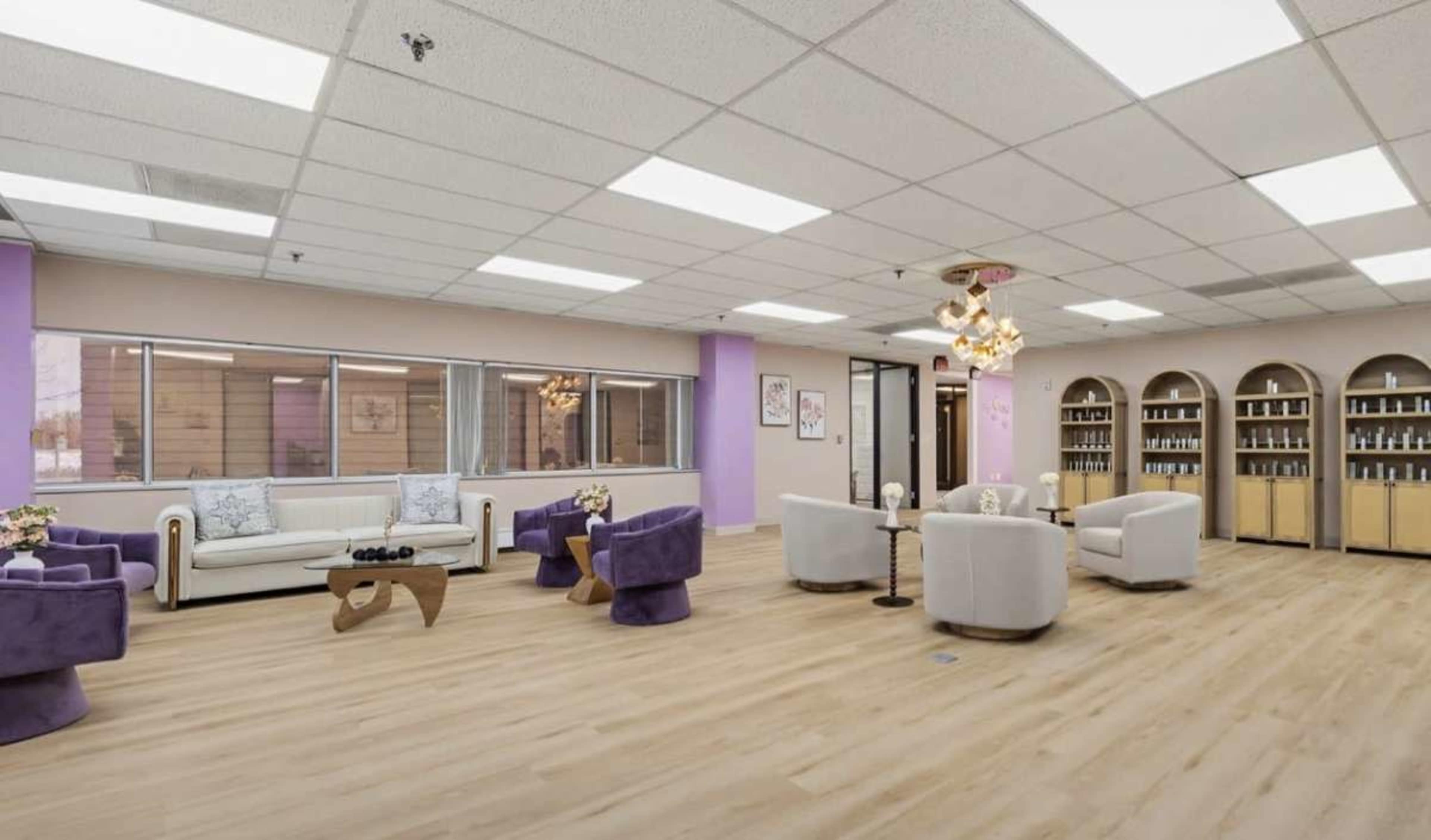 The image shows a spacious, well-lit reception area with modern seating arrangements and shelves displaying various products.