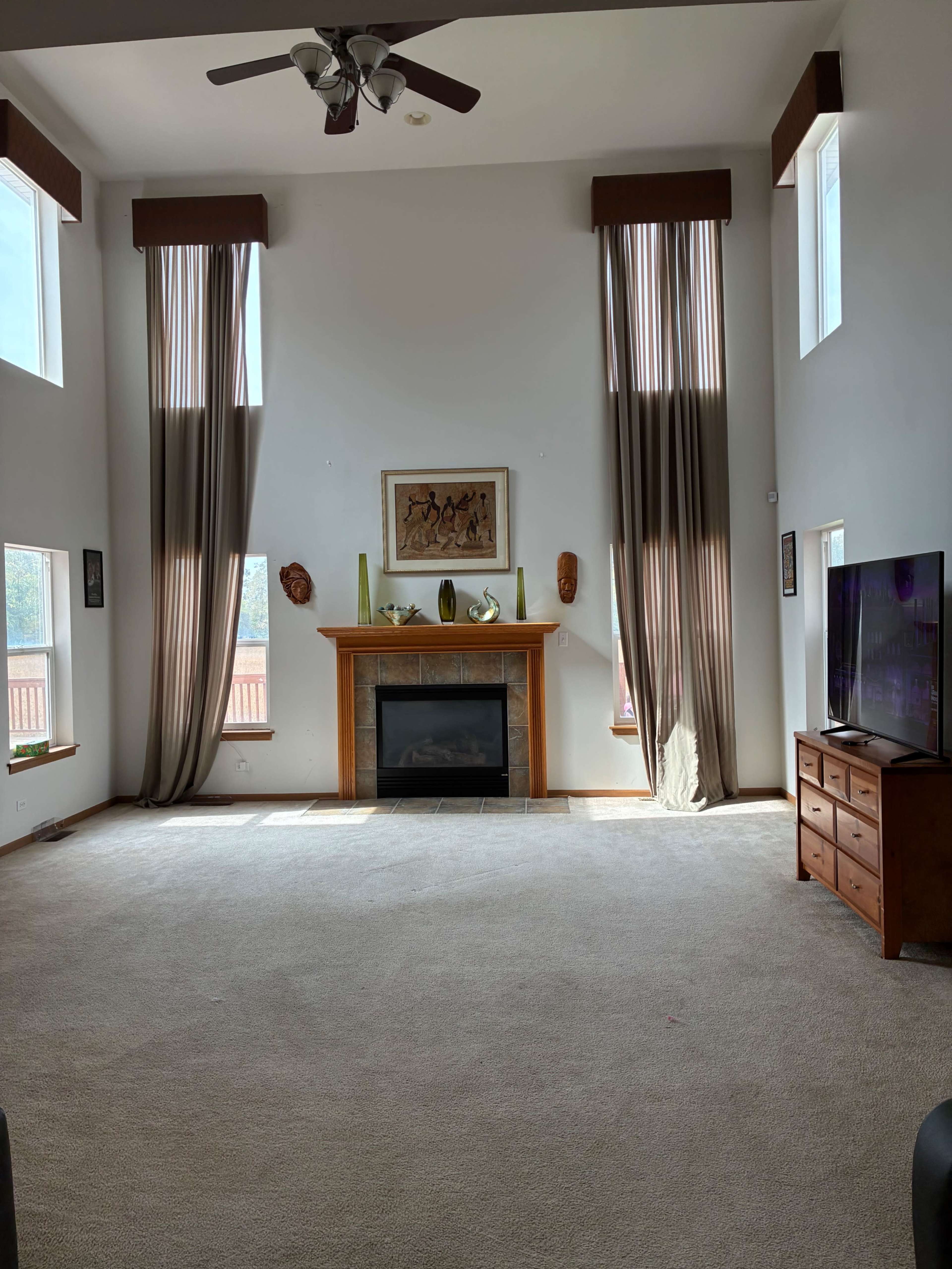 suburban open concept great-room and deck with beautiful forest preserve view Image in Thornton Township, South Holland, IL