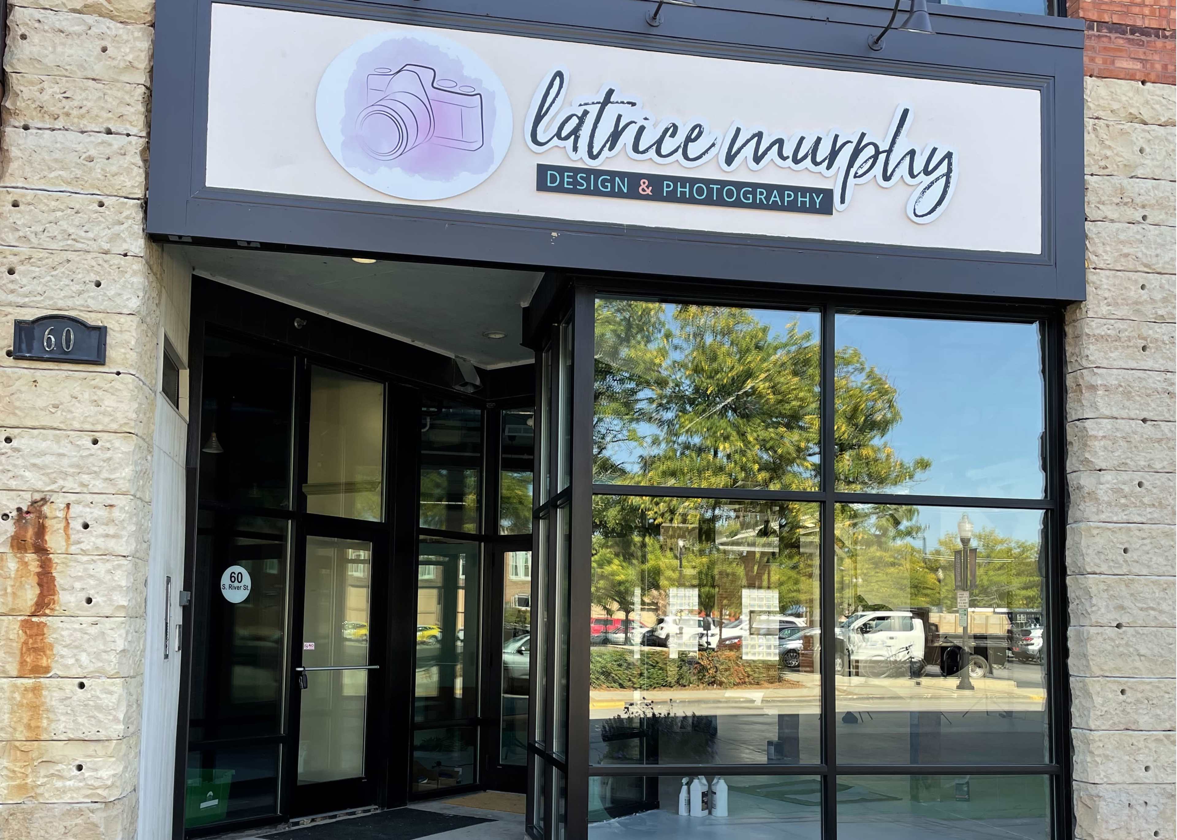 The entrance to a photography studio is marked by a sign that reads "latrice murphy Design & Photography."