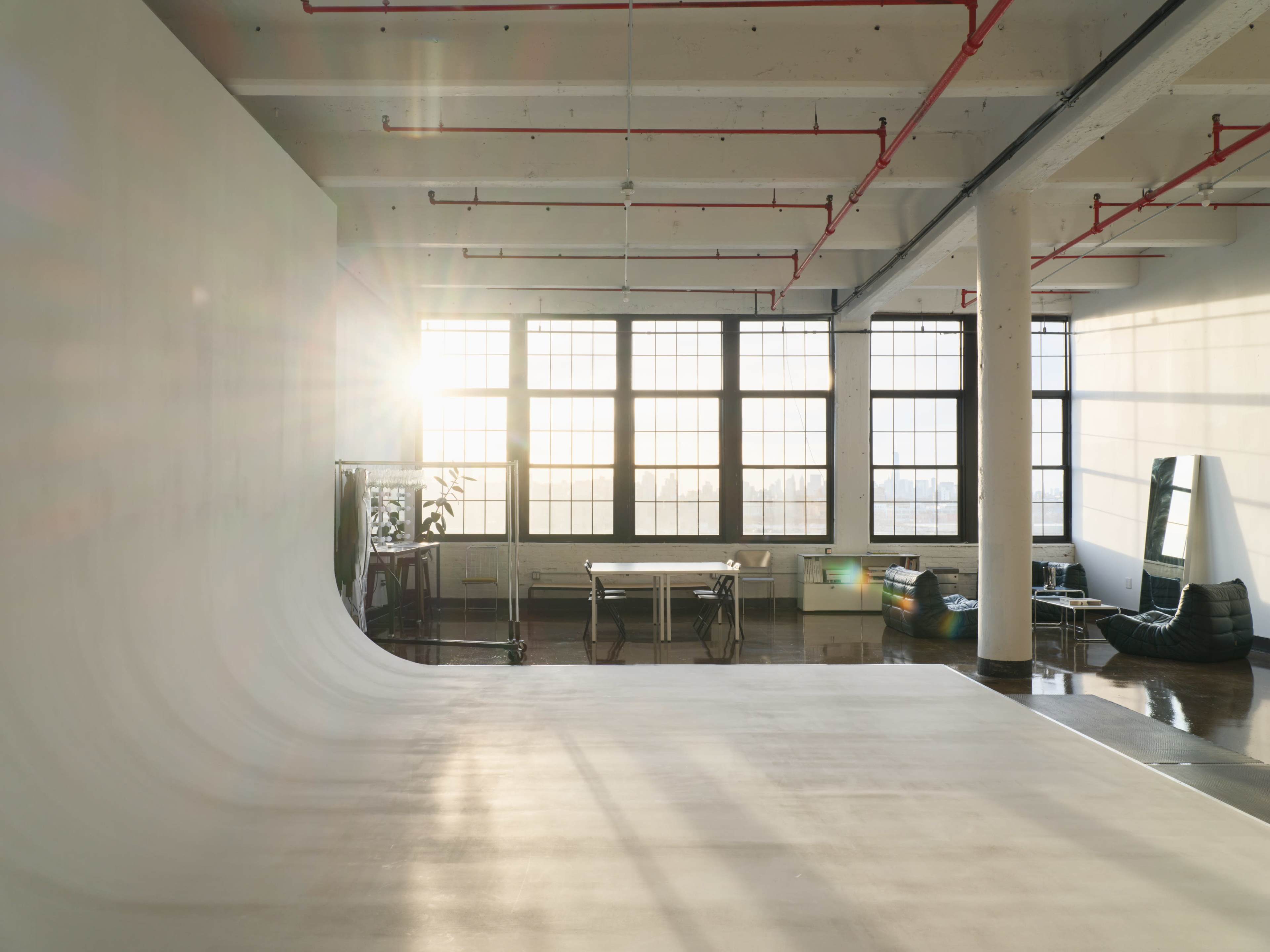 Bright Studio With Cyc Wall And Designer Furniture Image in Bushwick, Brooklyn, NY