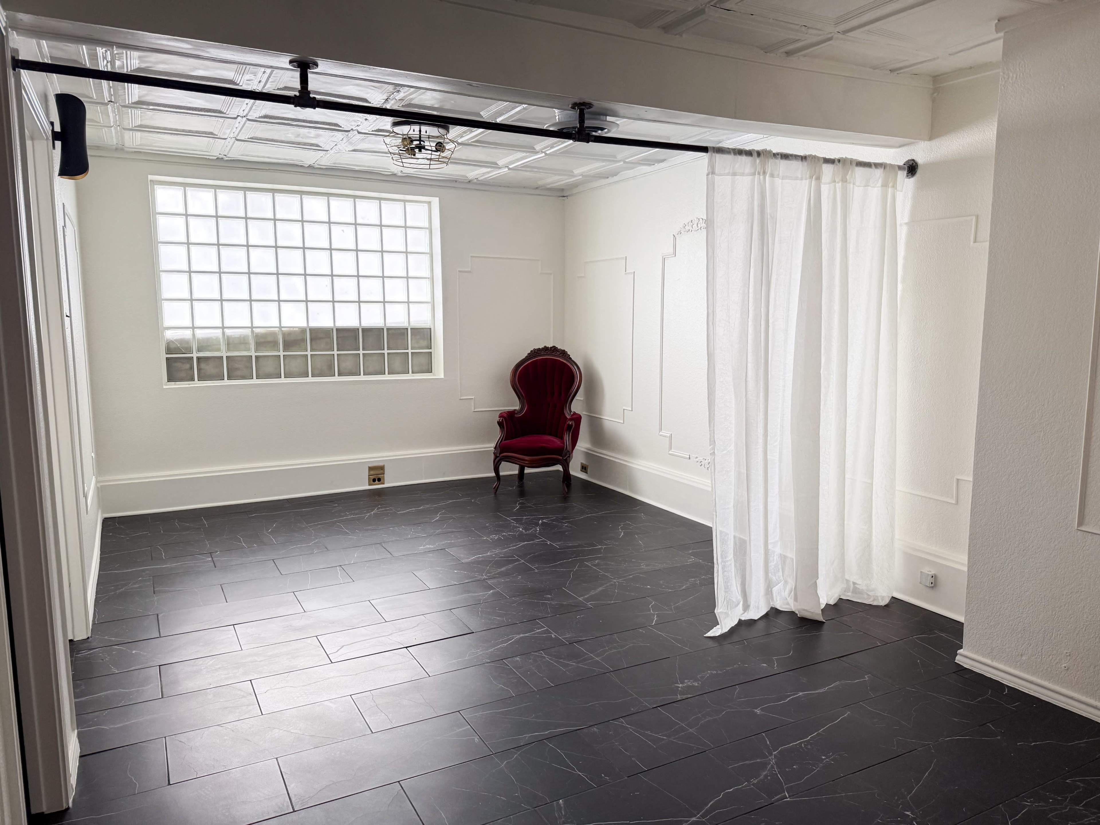 The Parisian Parlor at Archive Haus | a Natural Light all white European Style Studio Steps from the Denton Square Image in Denton, Denton, TX