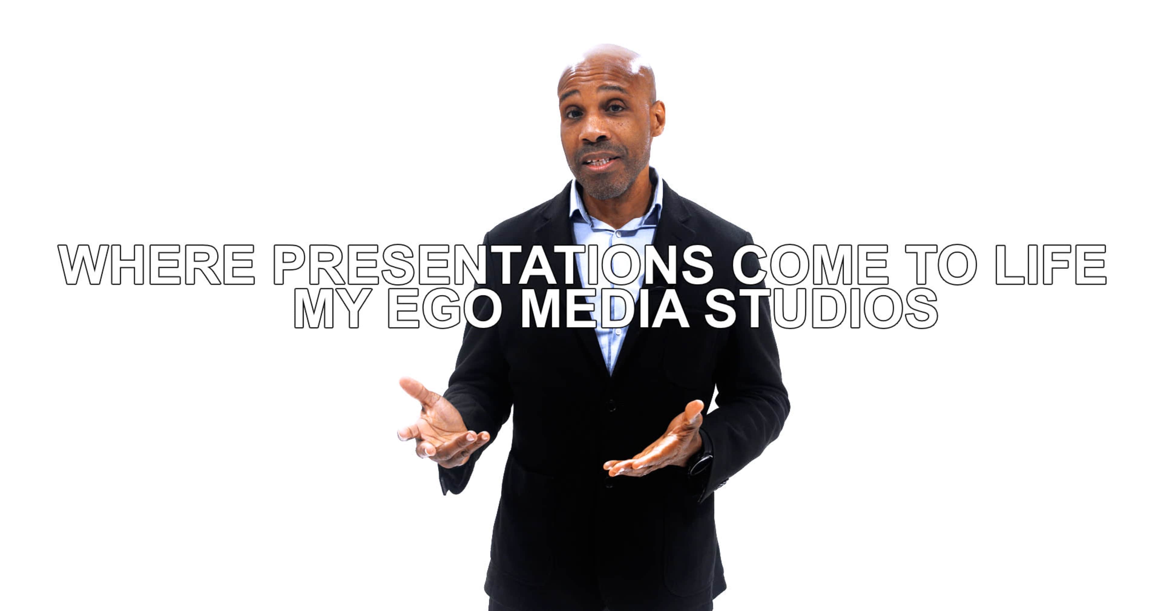 A man in a black blazer stands with his hands gesturing, displaying the text "WHERE PRESENTATIONS COME TO LIFE MY EGO MEDIA STUDIOS" against a white background.