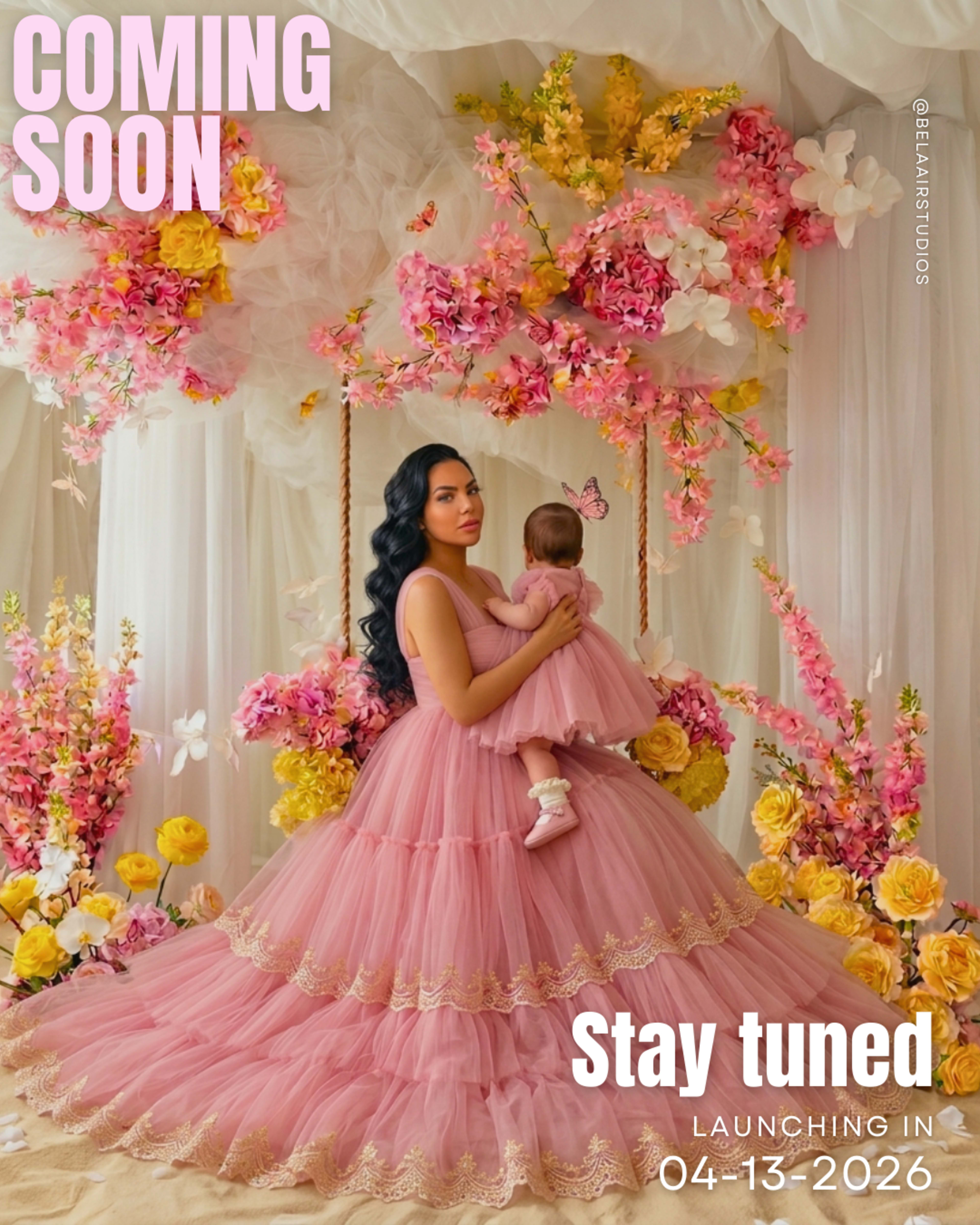 A woman in a long pink dress holds a baby in her arms against a backdrop of floral decorations and a "Coming Soon" announcement.
