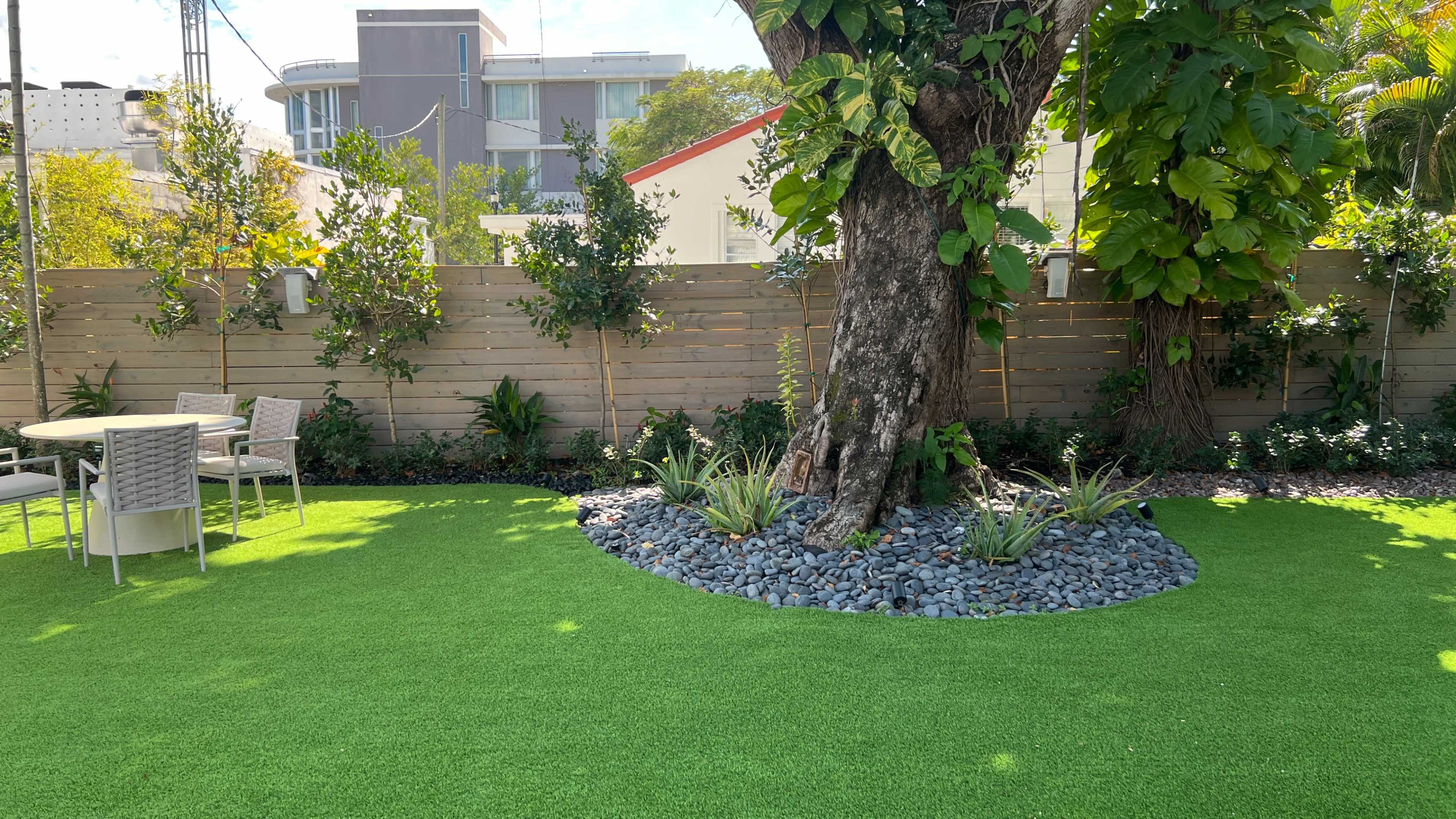 Beautifully landscaped backyard, with lighting, speakers and ambiance. Image in Miami, Miami, FL