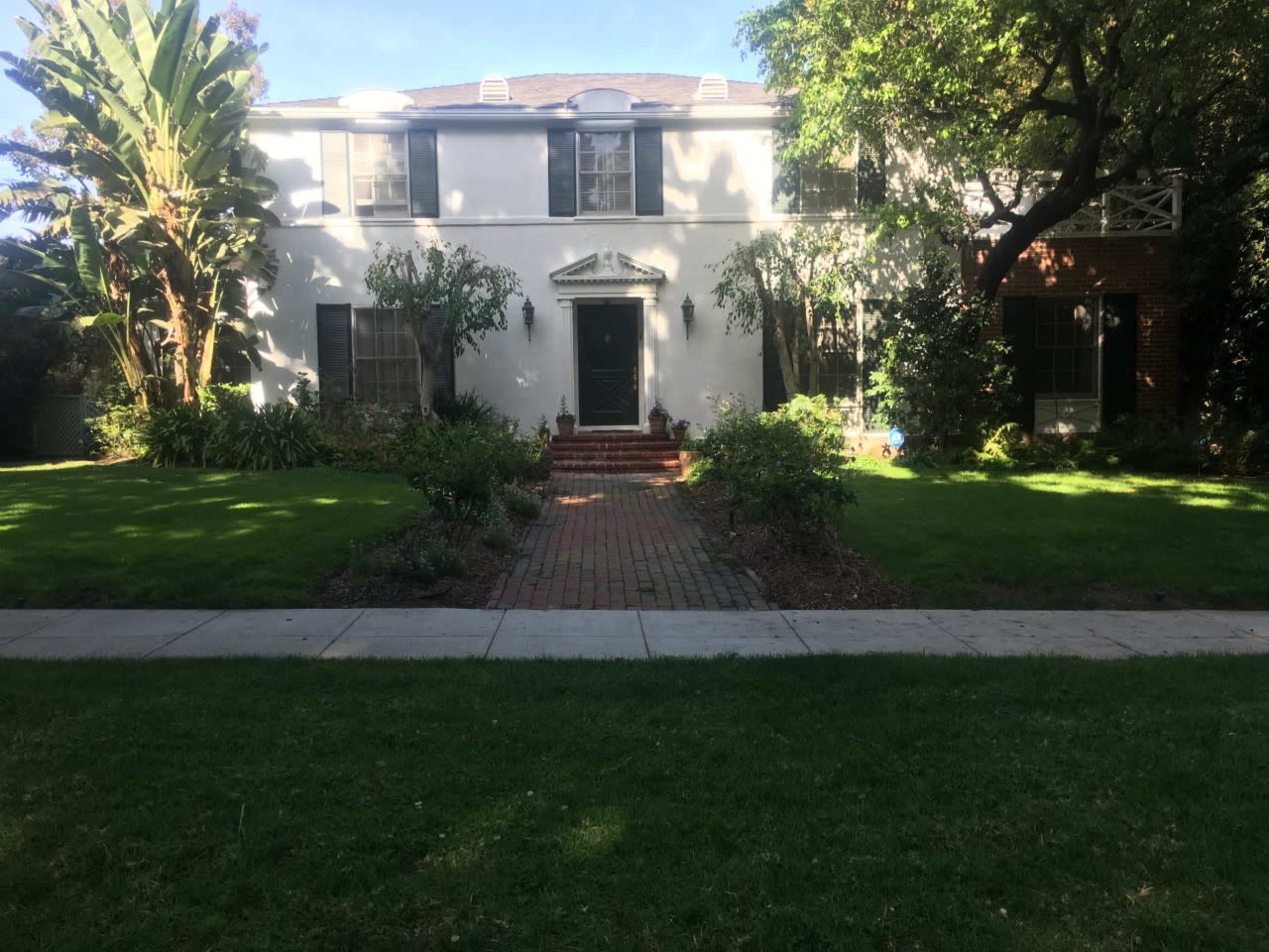Classic Beverly Hills 90210 house with lush backyard and pool. Image in The Flats, Beverly Hills, CA