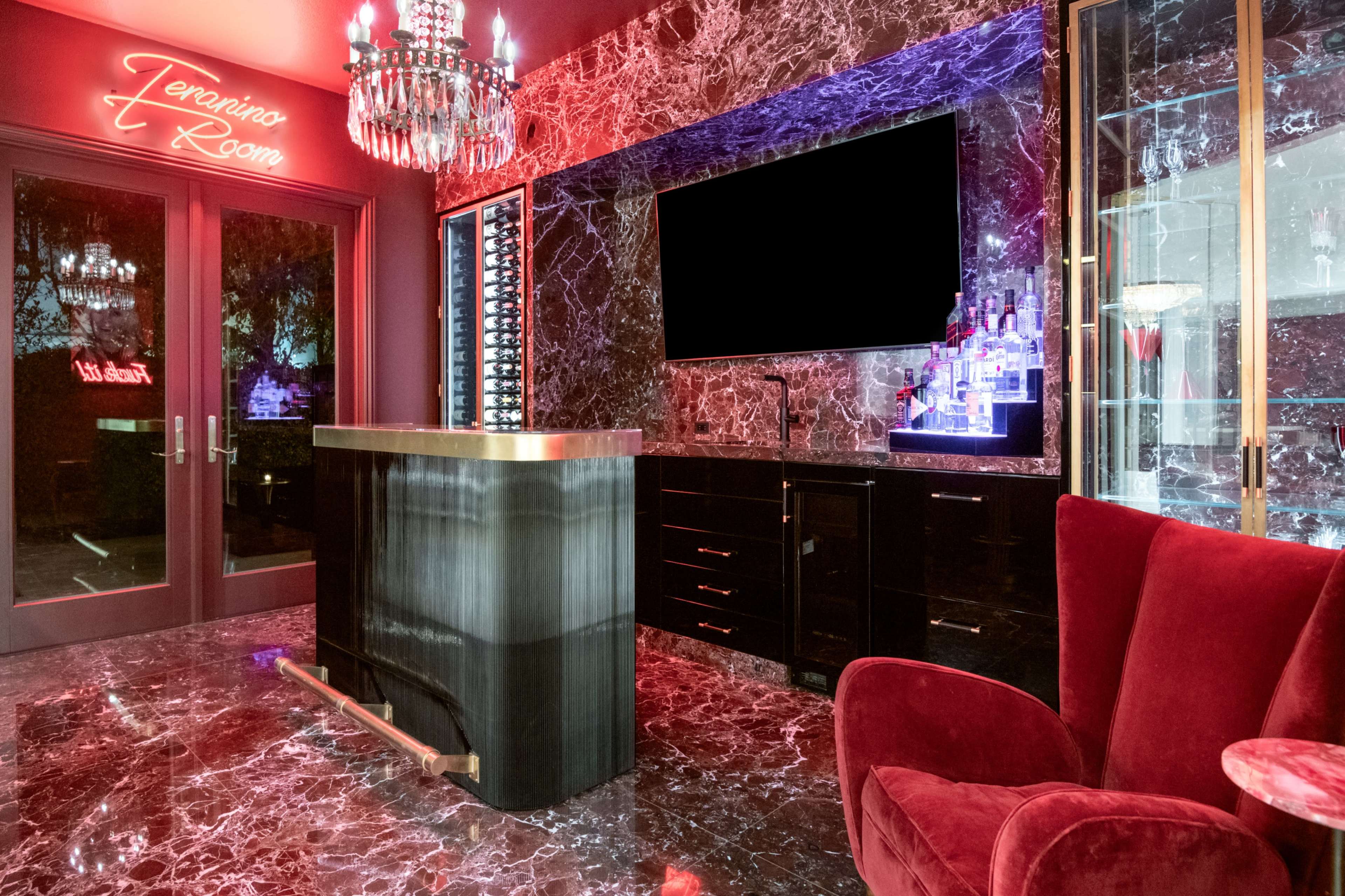 MODERN CHIC, WHITE WALLS, GLASS ENTRY DOUBLE STAIRCASE, RUBY STONED LEATHER WALLED COCKTAIL BAR FEATURE. Image in Moorpark, Moorpark, CA