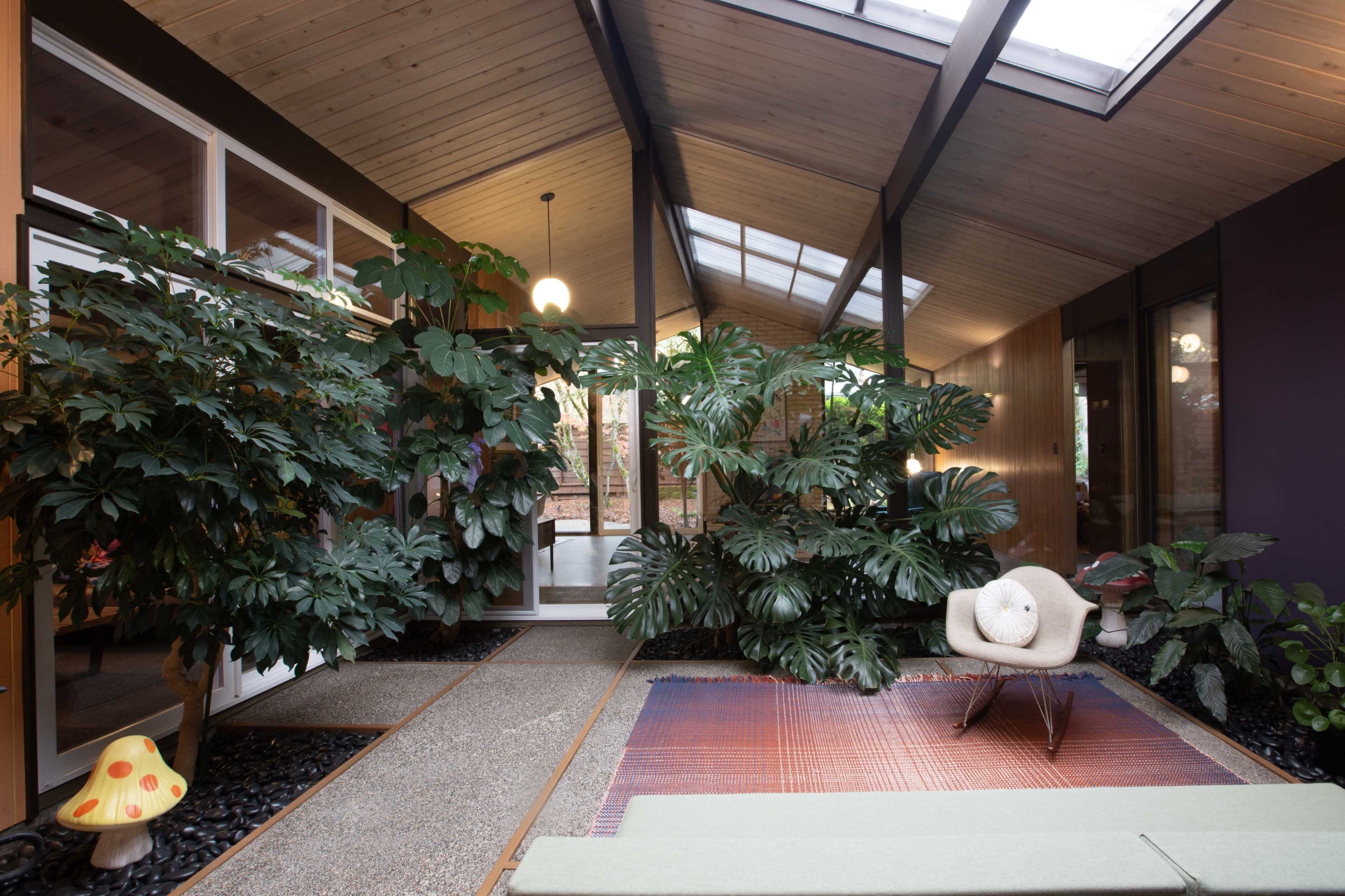 Mid-Century Rummer Atrium House with Lush Indoor Garden Image in Garden Home-Whitford, Portland, OR