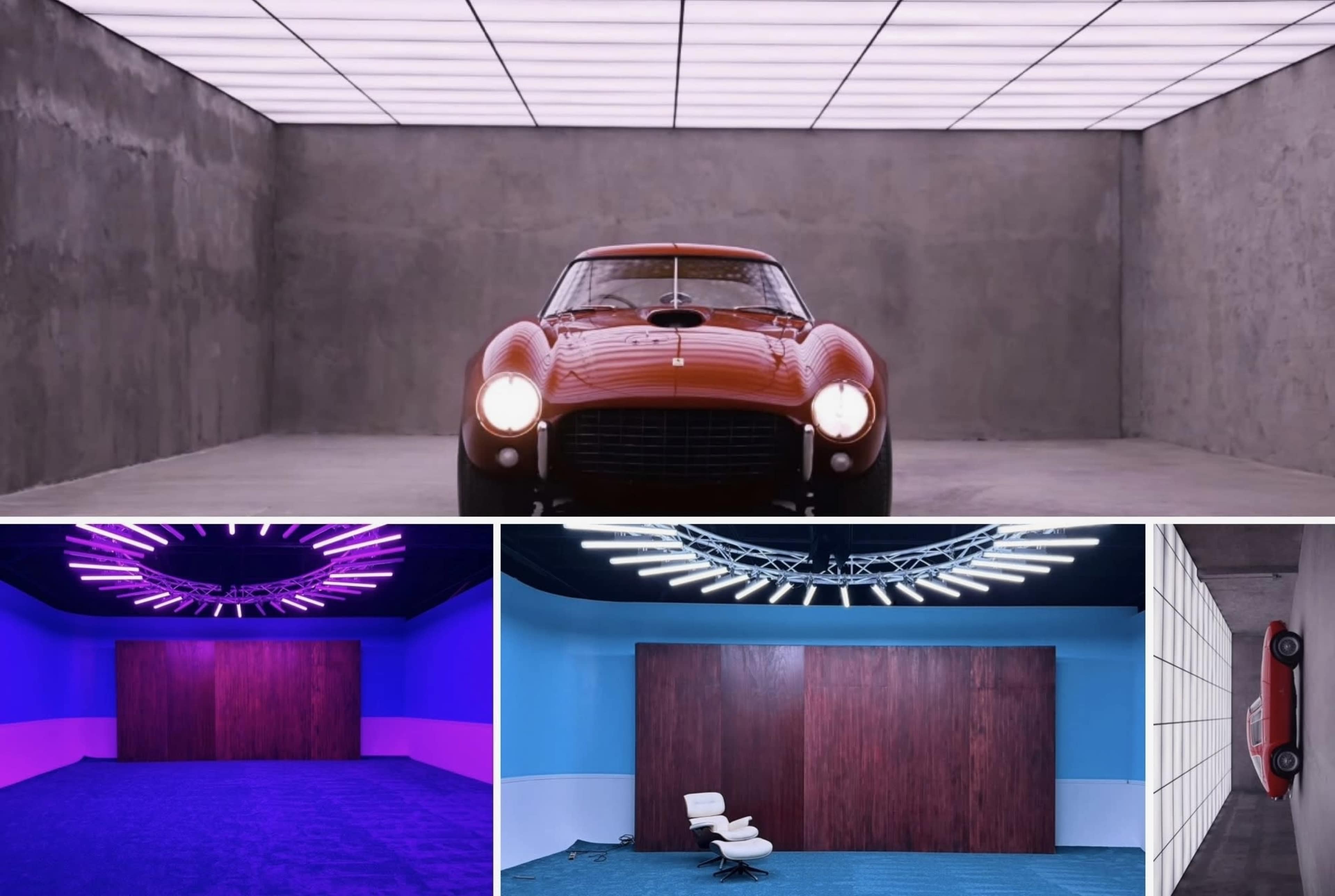A red vintage sports car is prominently displayed in an illuminated, minimalist garage.