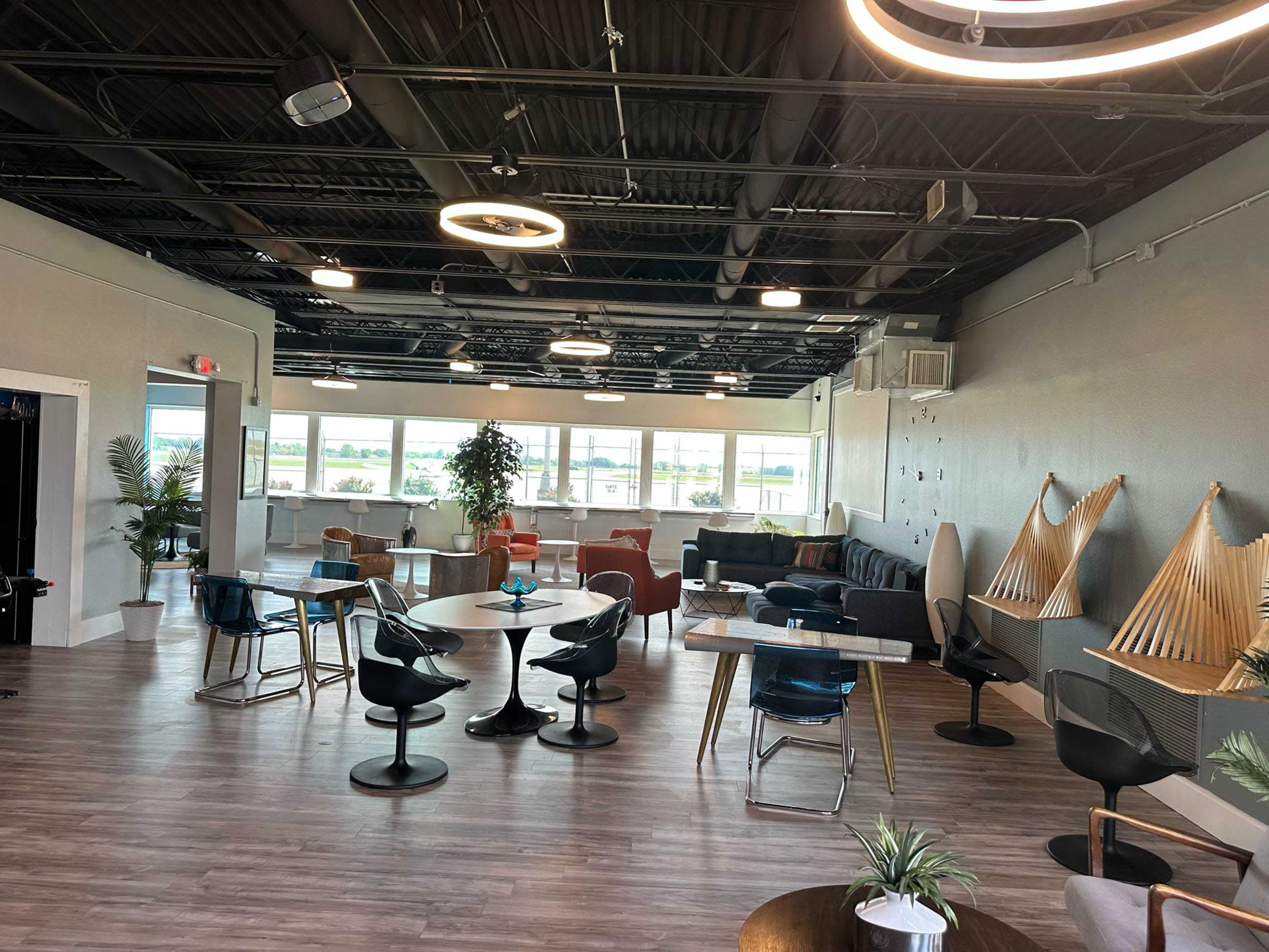 Modern Aviation Lounge with Runway Views + Retro Arcade Vibe Image in Wood River Township, East Alton, IL