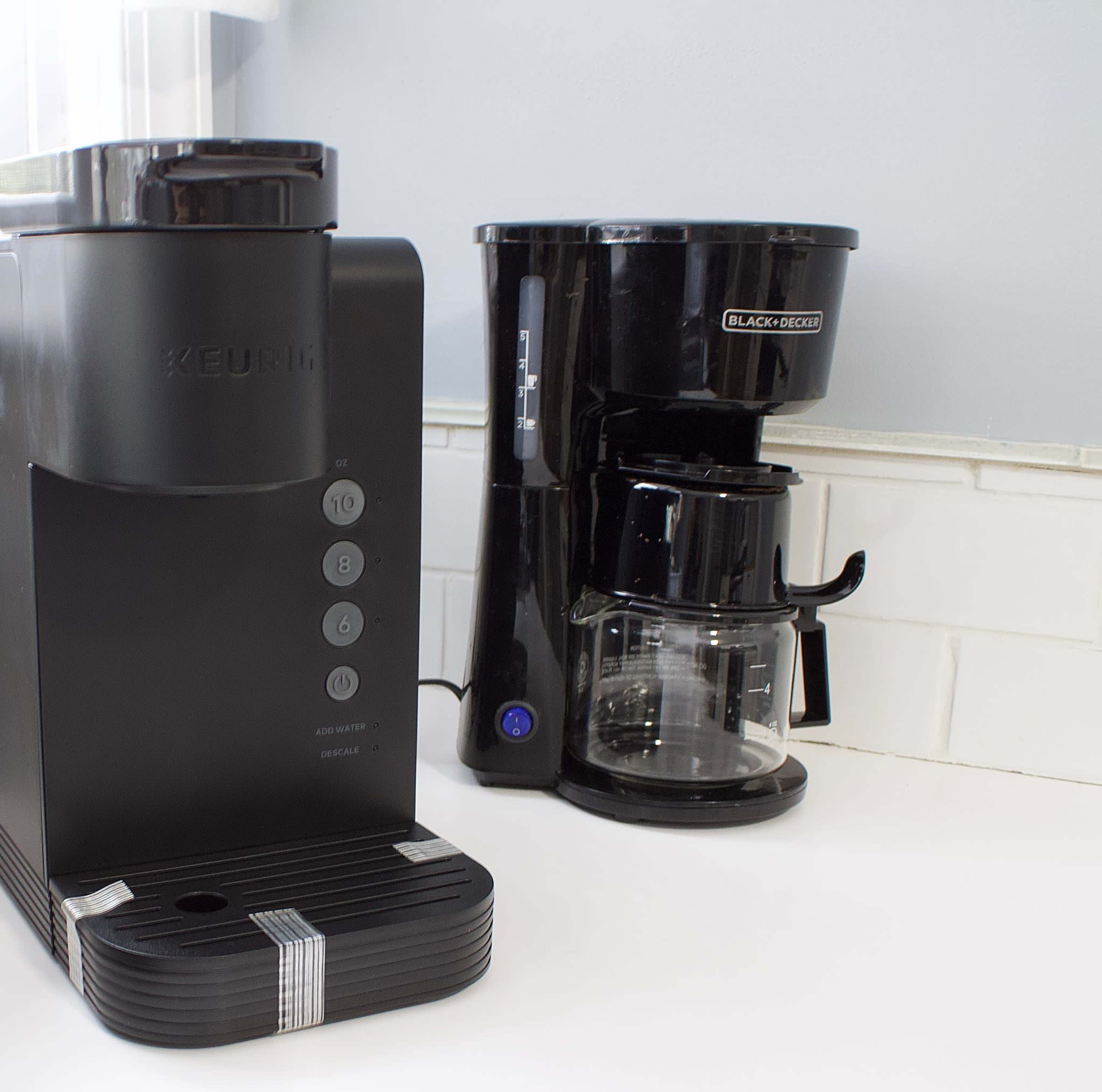 A Keurig coffee maker is placed next to a Black+Decker drip coffee maker on a kitchen countertop.
