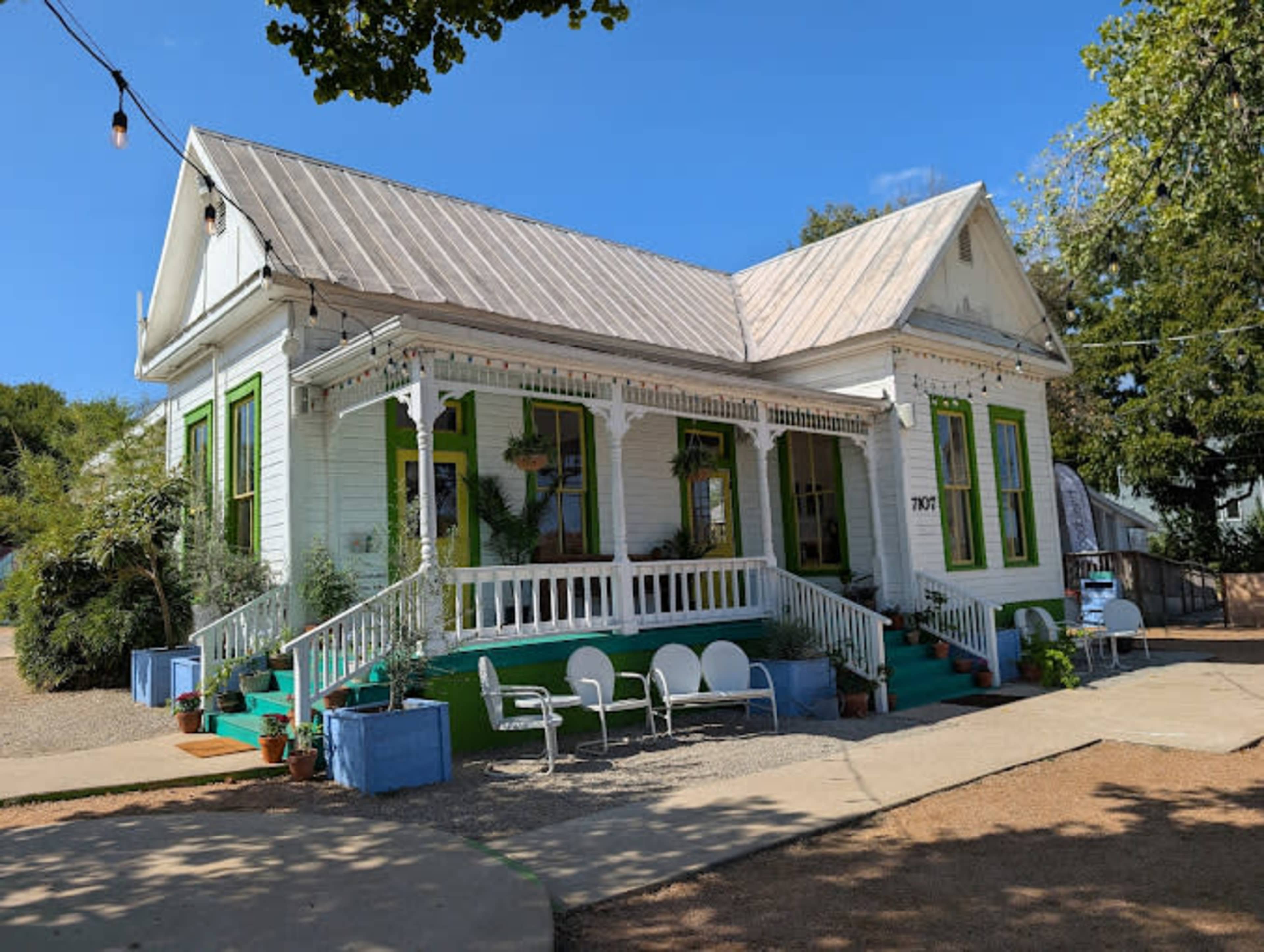 Cute historical house with a huge patio and lovely vibes. Image in Montopolis, Austin, TX