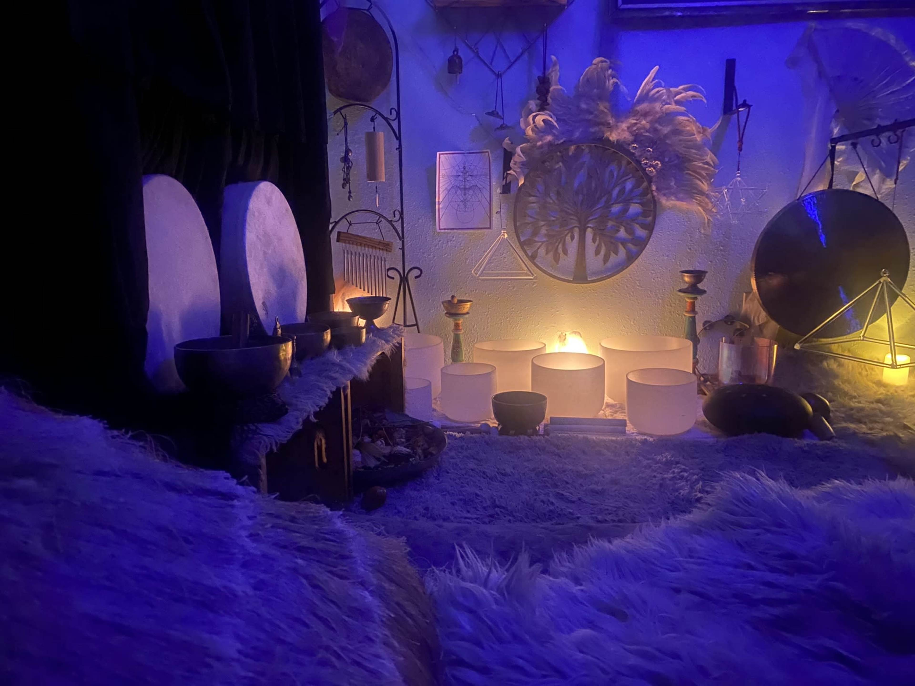 The scene depicts a dimly lit room adorned with various decorative items, including crystal bowls and soft textures, creating a tranquil ambiance.