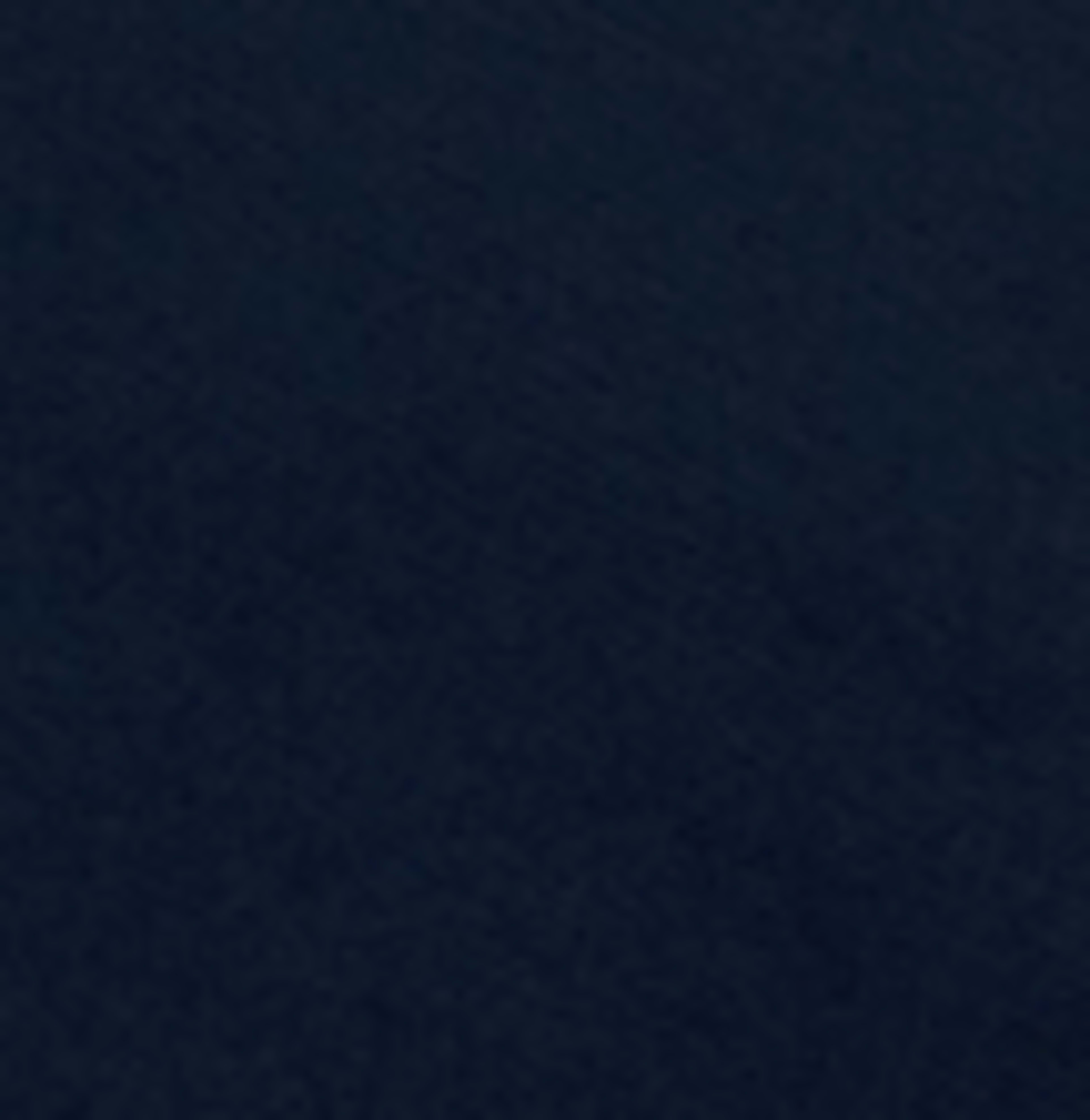 The image shows a solid dark blue surface with a textured appearance.