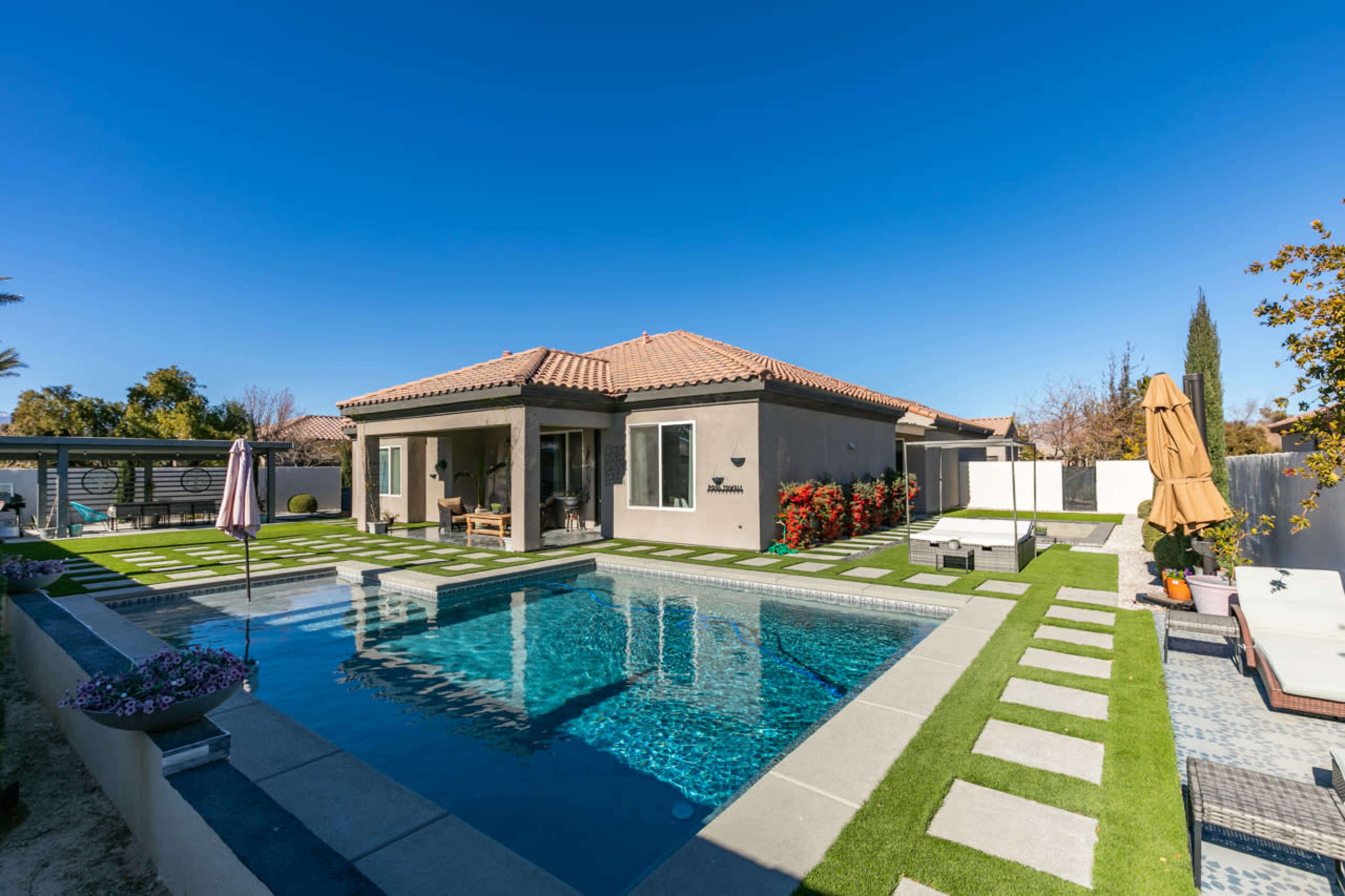 Whimsical Private backyard with pool , patio, fire pit in quiet North West Las Vegas neighborhood. Image in Wyeth Ranch, Las Vegas, NV