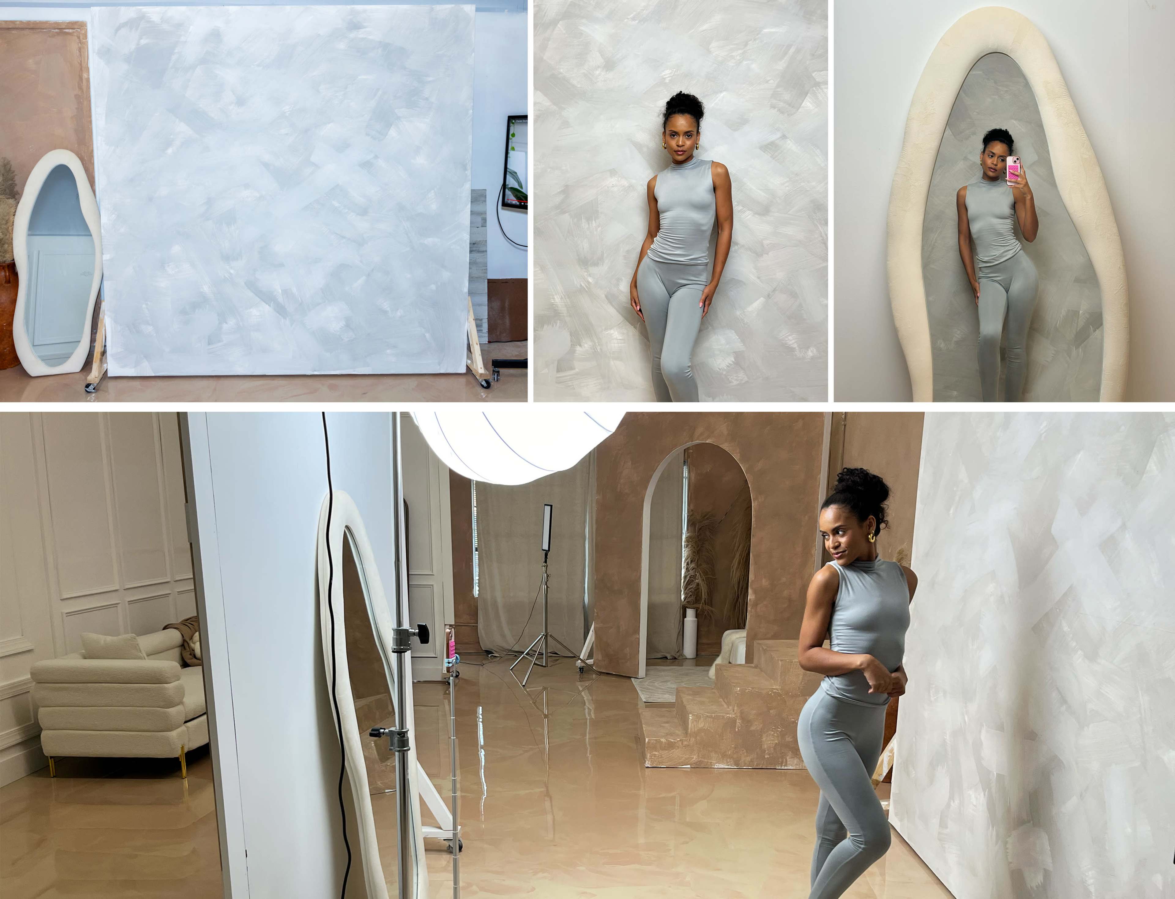 The image features a model posing in a sleek, minimalist studio with a large, abstract white backdrop and a uniquely shaped mirror.