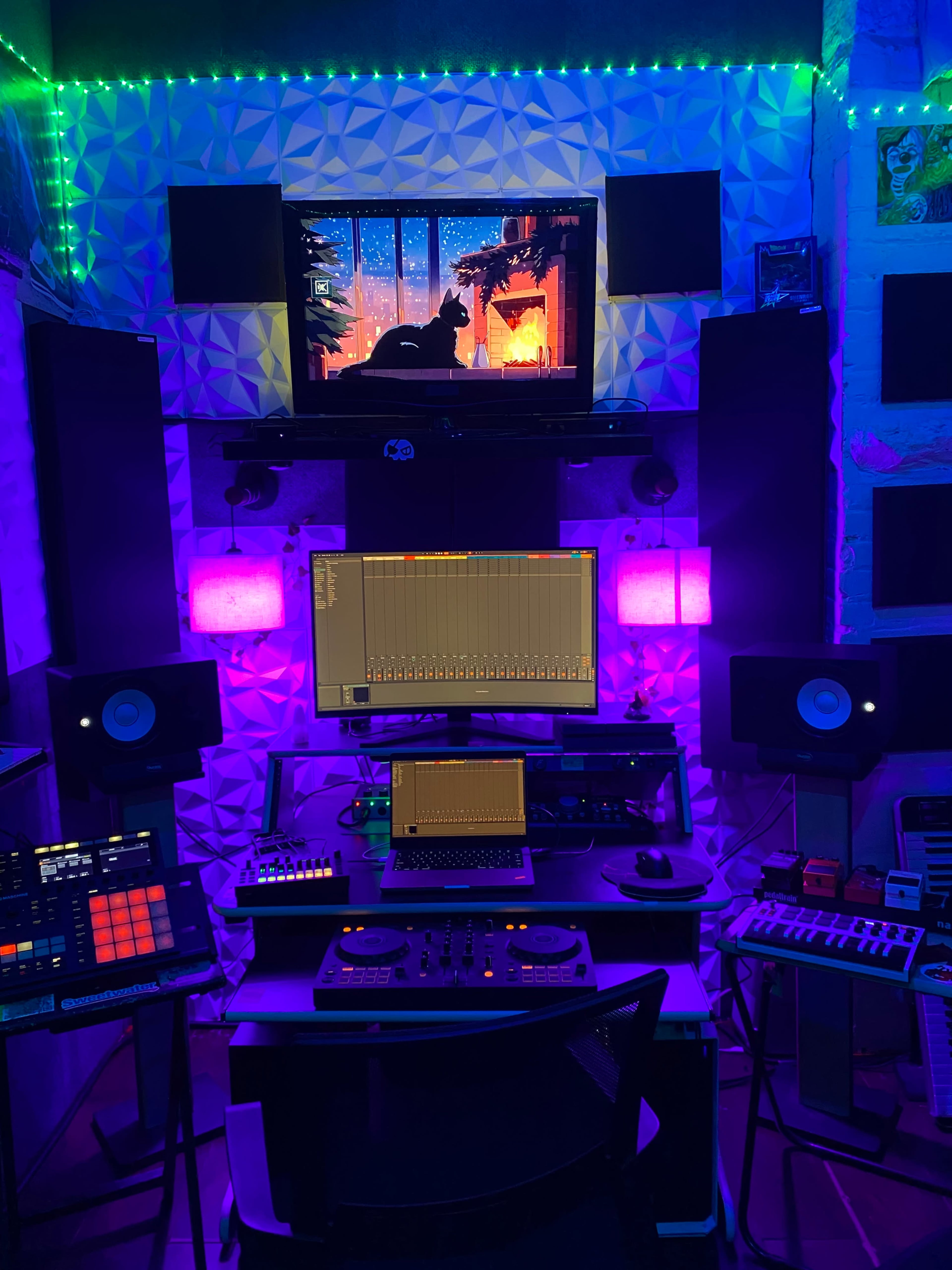 The image depicts a music production studio with multiple screens, synthesizers, and colorful ambient lighting.