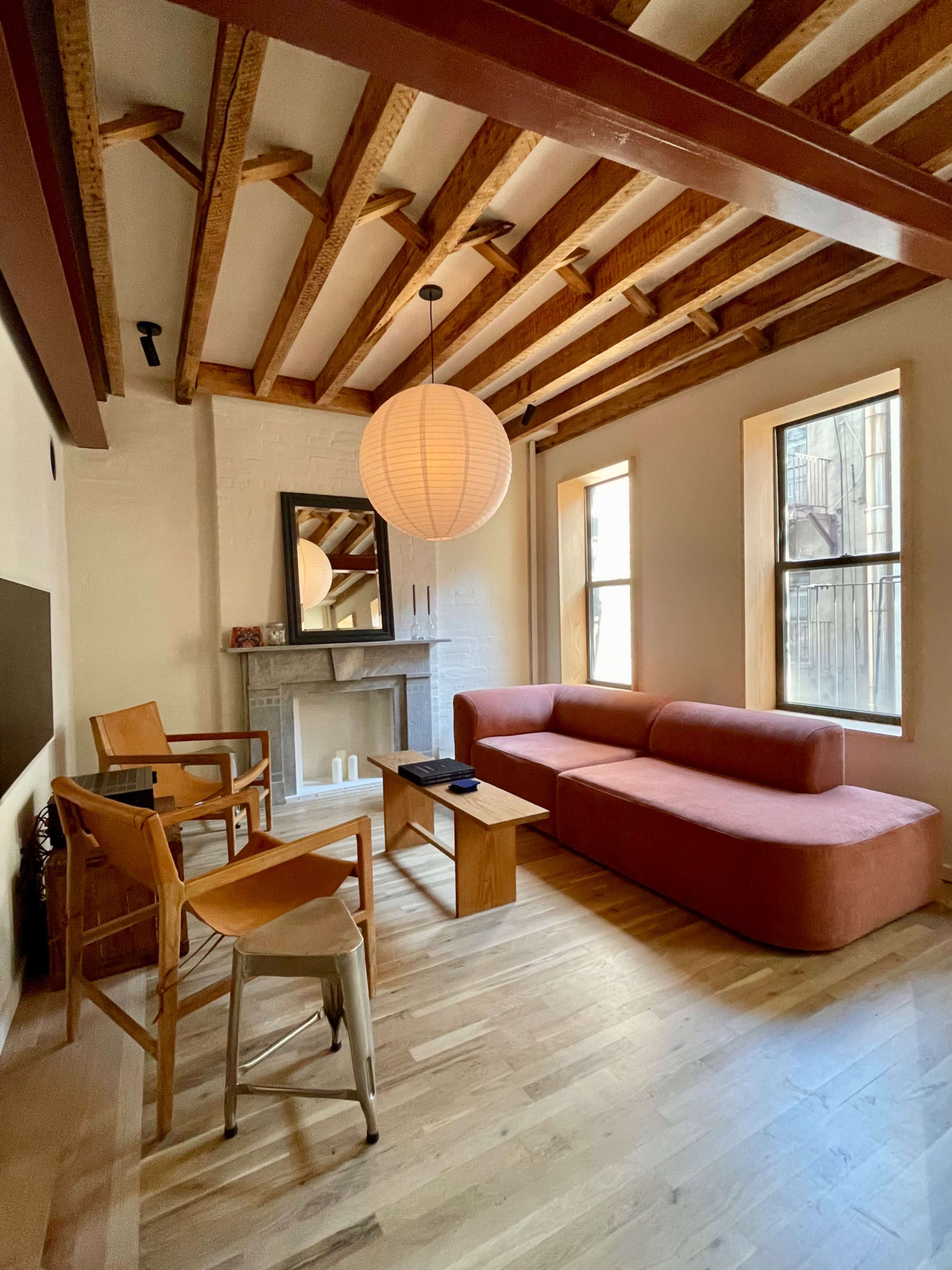 Stylish Wood Beamed Apartment With Two Decorative Fireplaces Image in East Village, New York, NY
