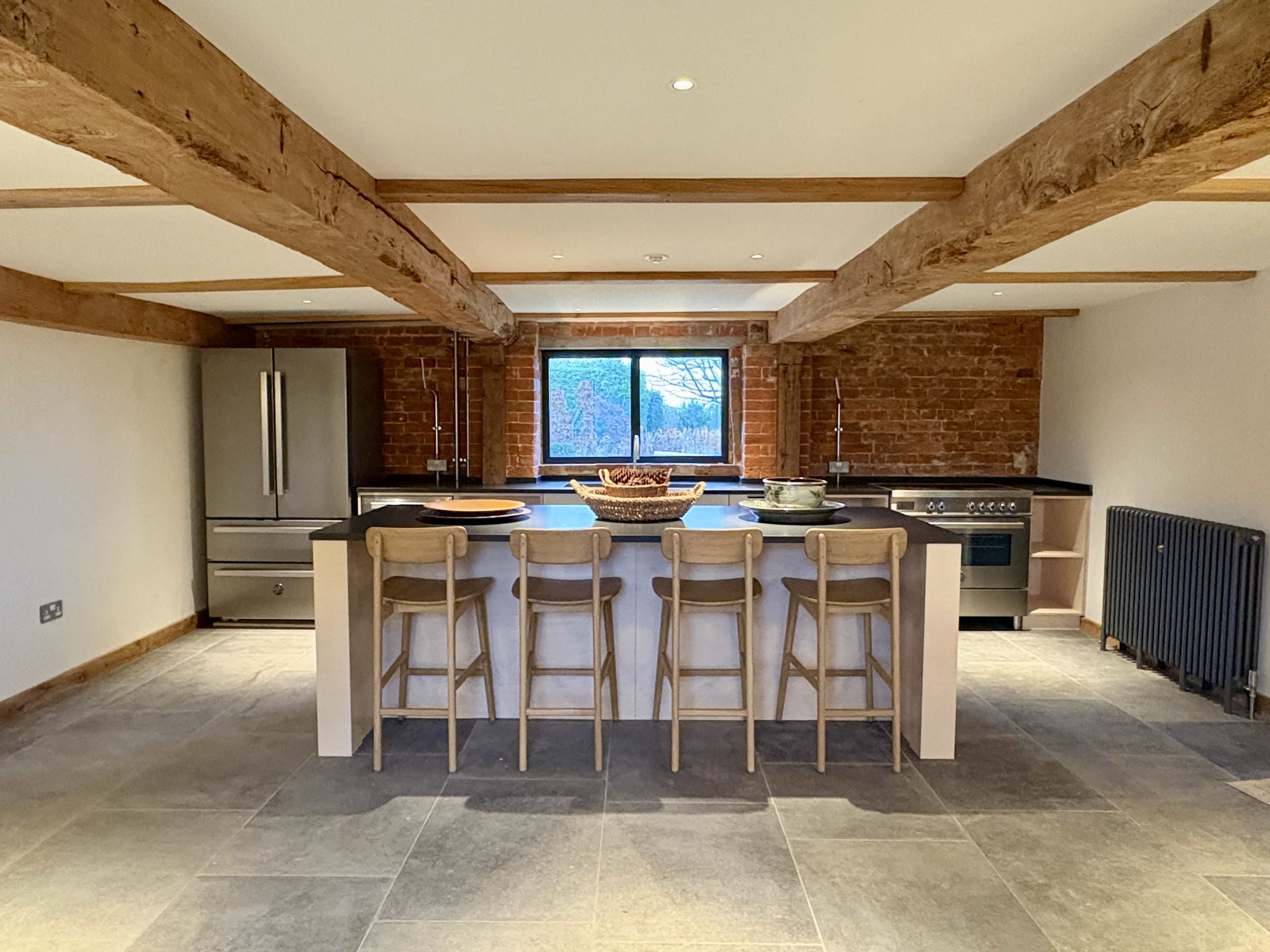 Unique barn space with floor-to-ceiling windows, exposed brick walls and a fully equipped kitchen Image in Edington, Westbury, ENG