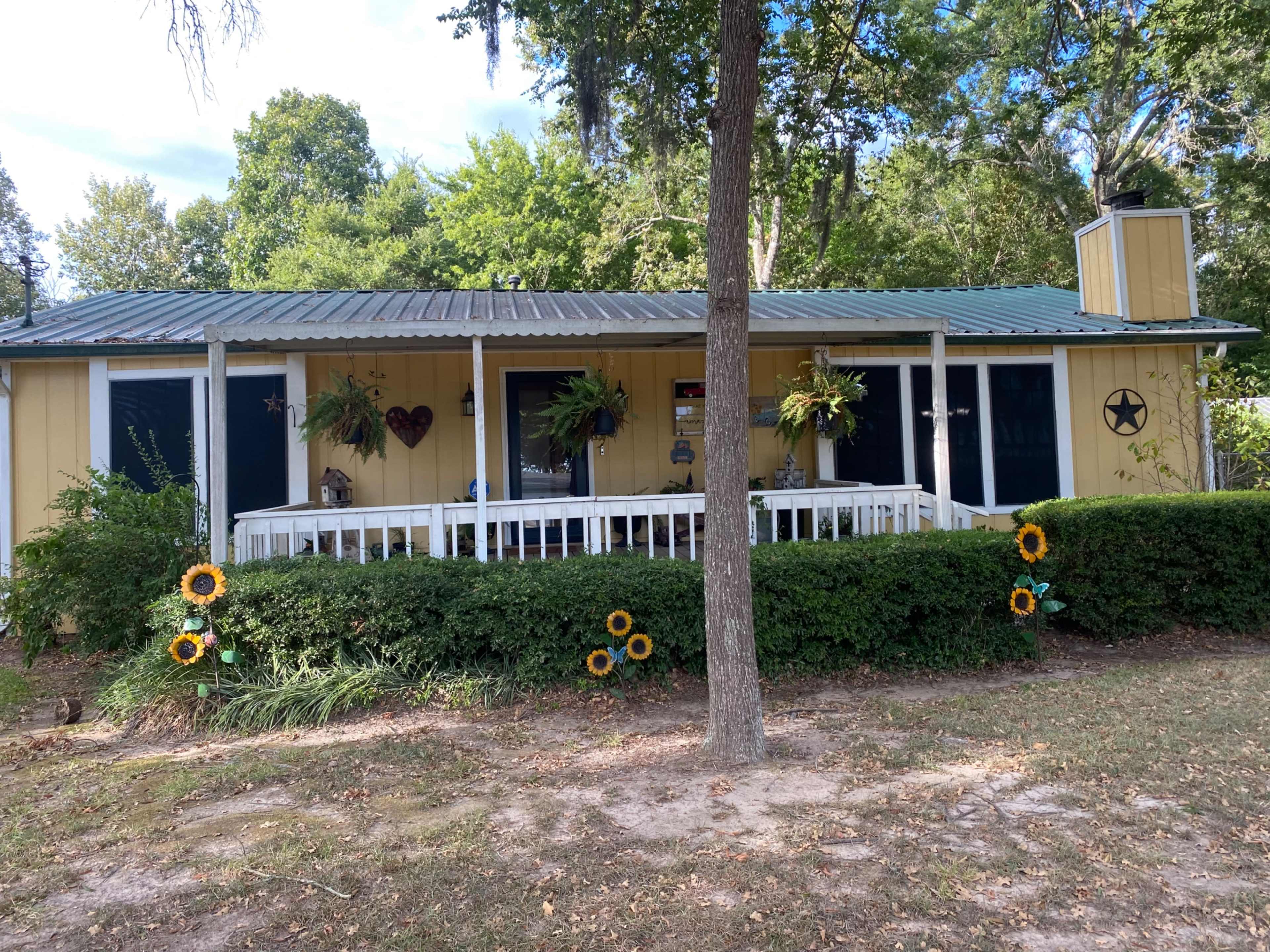 Lake area home with large gazebo and fenced backyard. Image in West Livingston, Livingston, TX