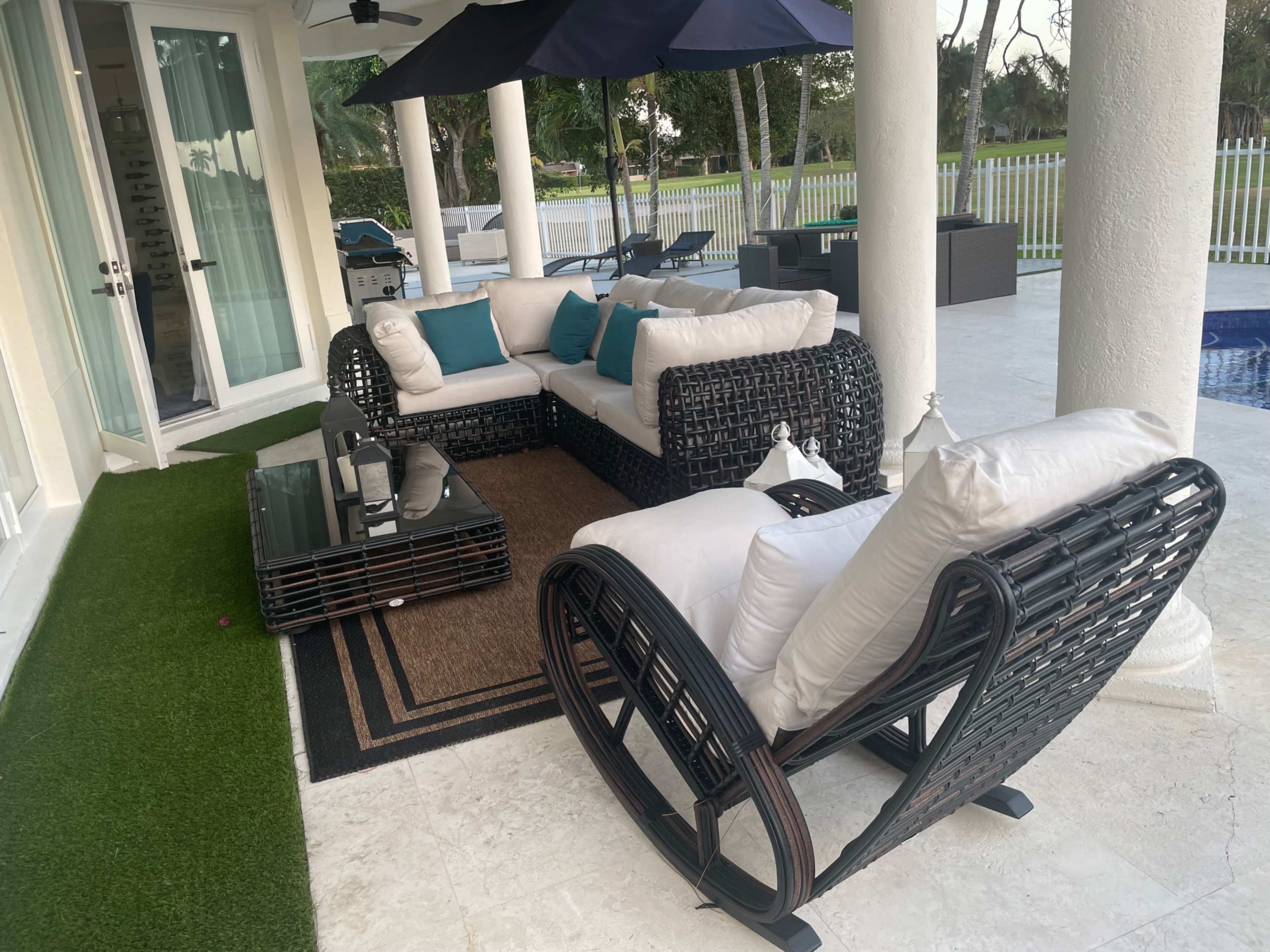 Country club, suburban, outdoor area with pool. Golf course view, roomy area with plenty of seating. Image in Country Club, Miami, FL