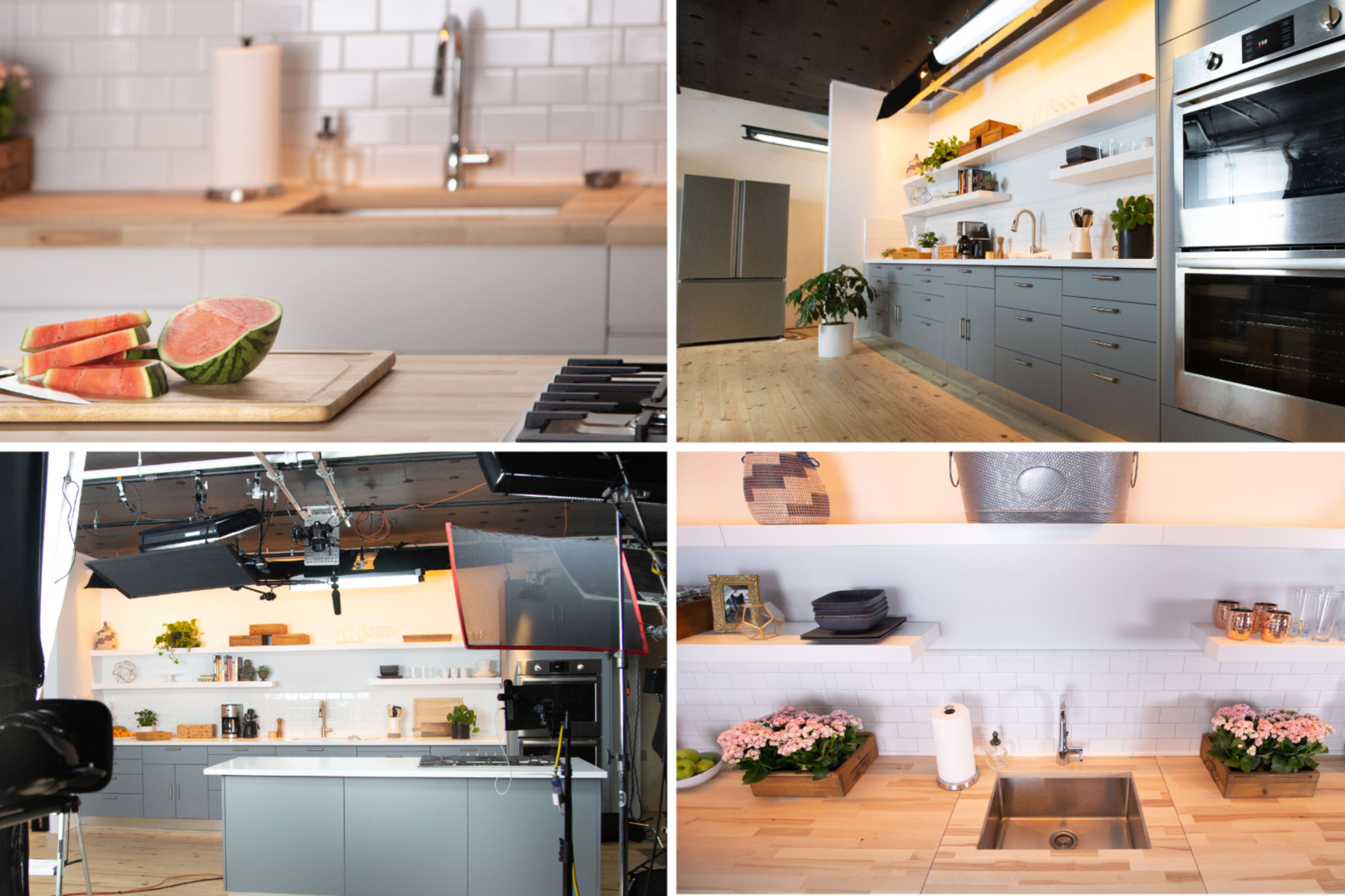 The image showcases a modern kitchen setup with a light wood countertop, various kitchen appliances, fresh produce, and organized shelves displaying cookware and plants.