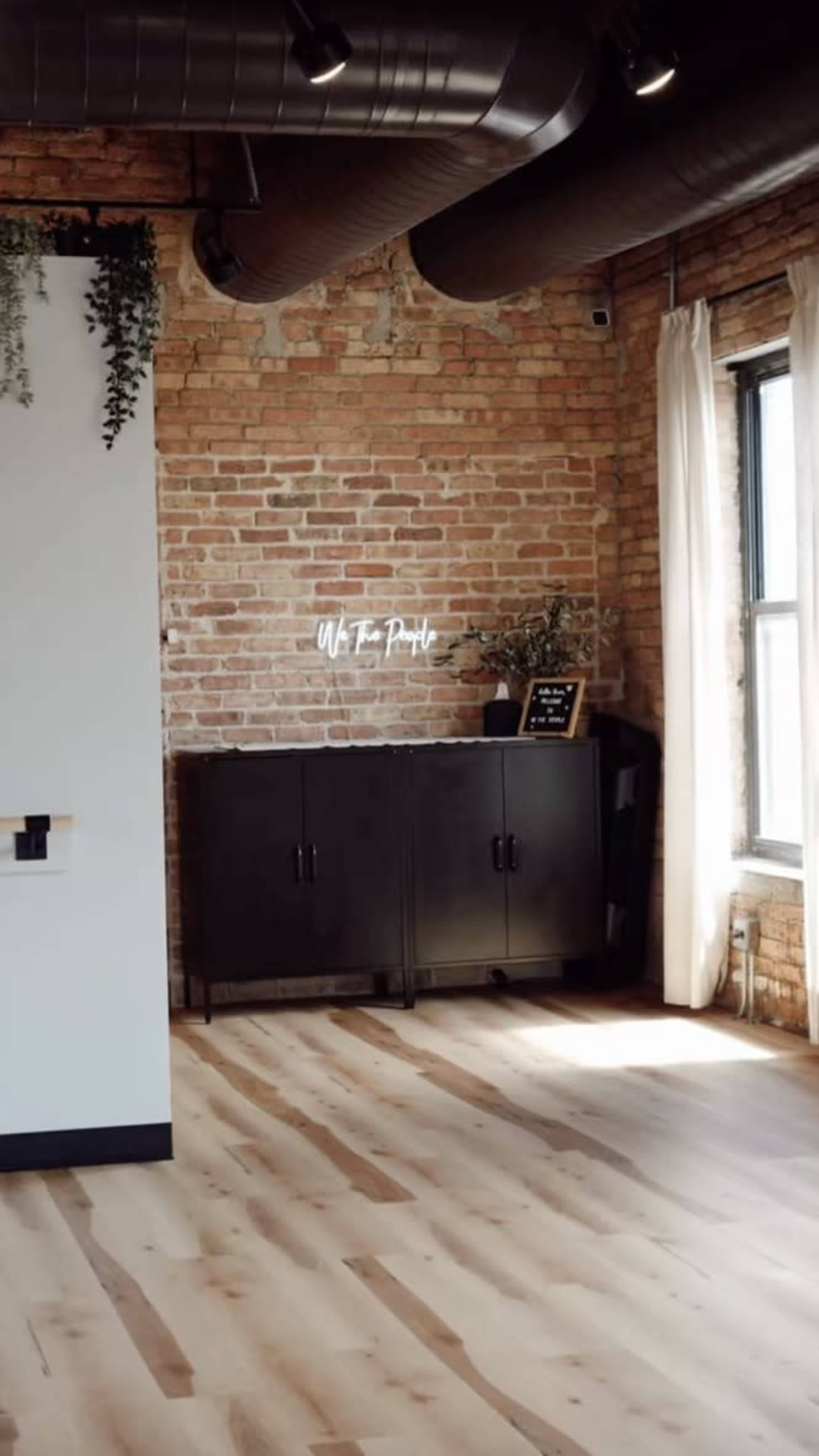 Beautiful timber loft fitness studio with equipment, skyline view and outdoor space. Image in Near North Side, Chicago, IL