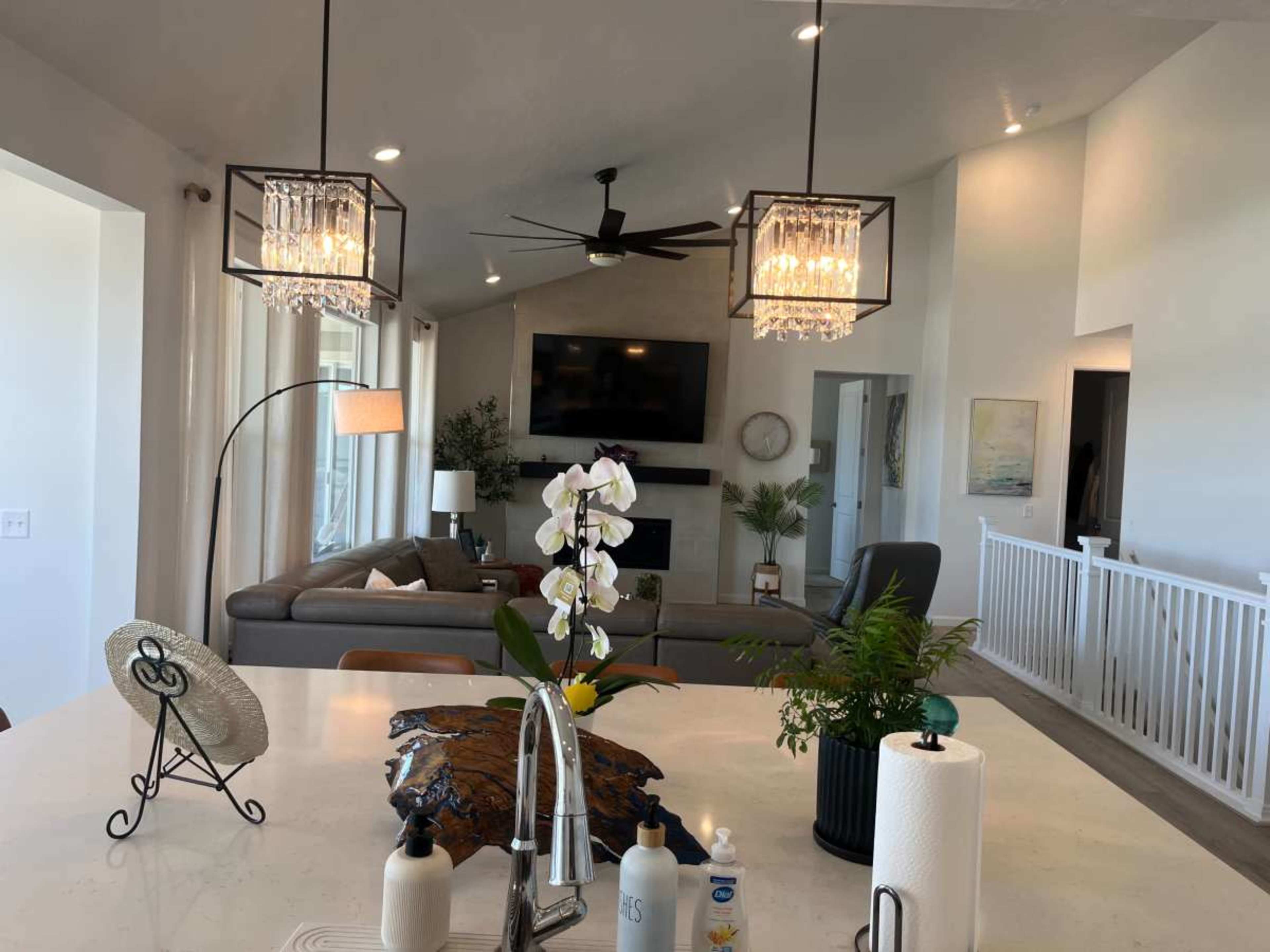 Urban home with vaulted ceilings, open concept, modern with a very large primary bedroom, cozy comfortable but modern feel., looks like a Hallmark setting. Image in Lake Point, Lake Point, UT