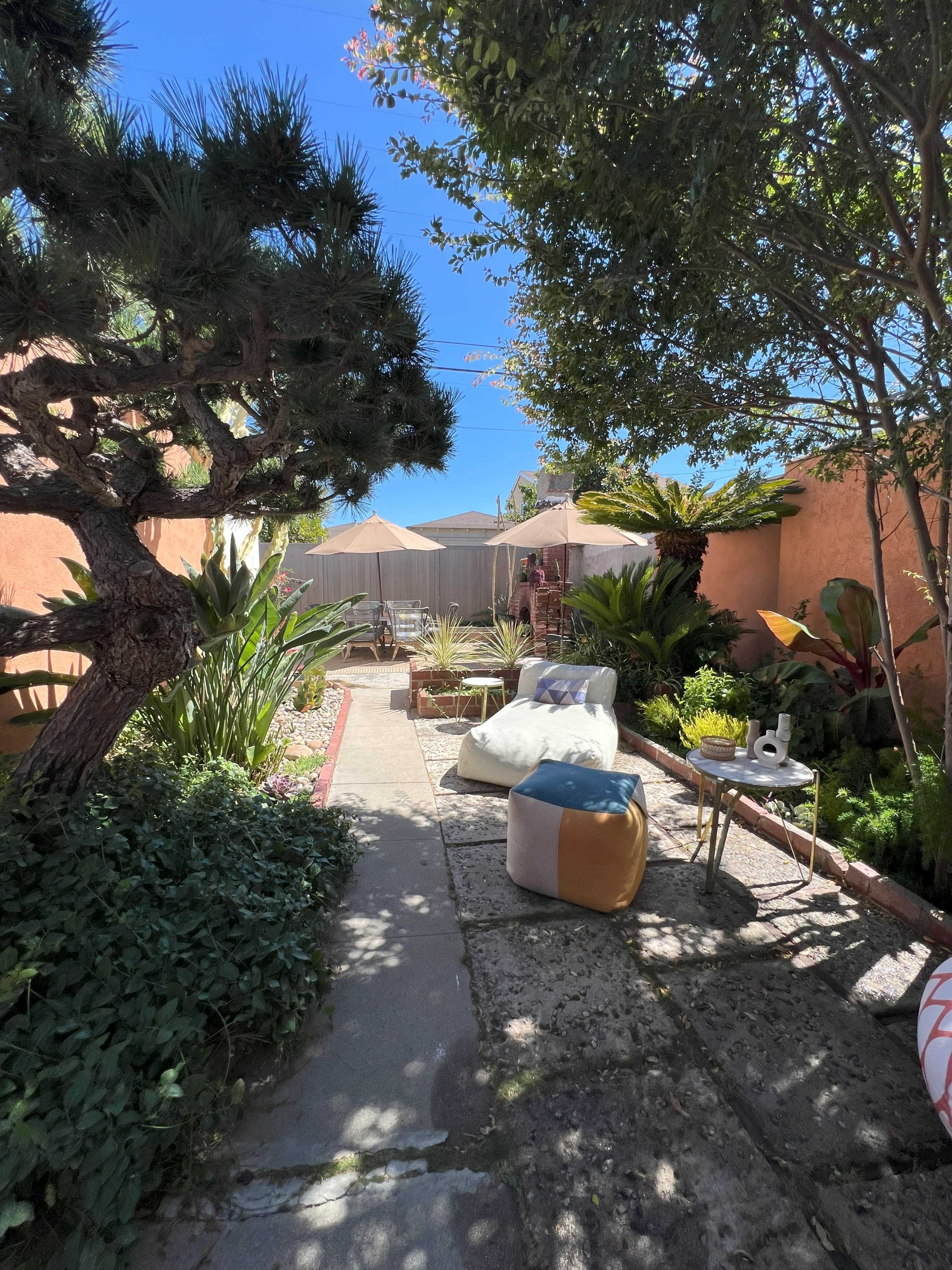 Charming Spanish-Style Backyard with Lush Garden & Private Nooks Image in Hyde Park, Los Angeles, CA
