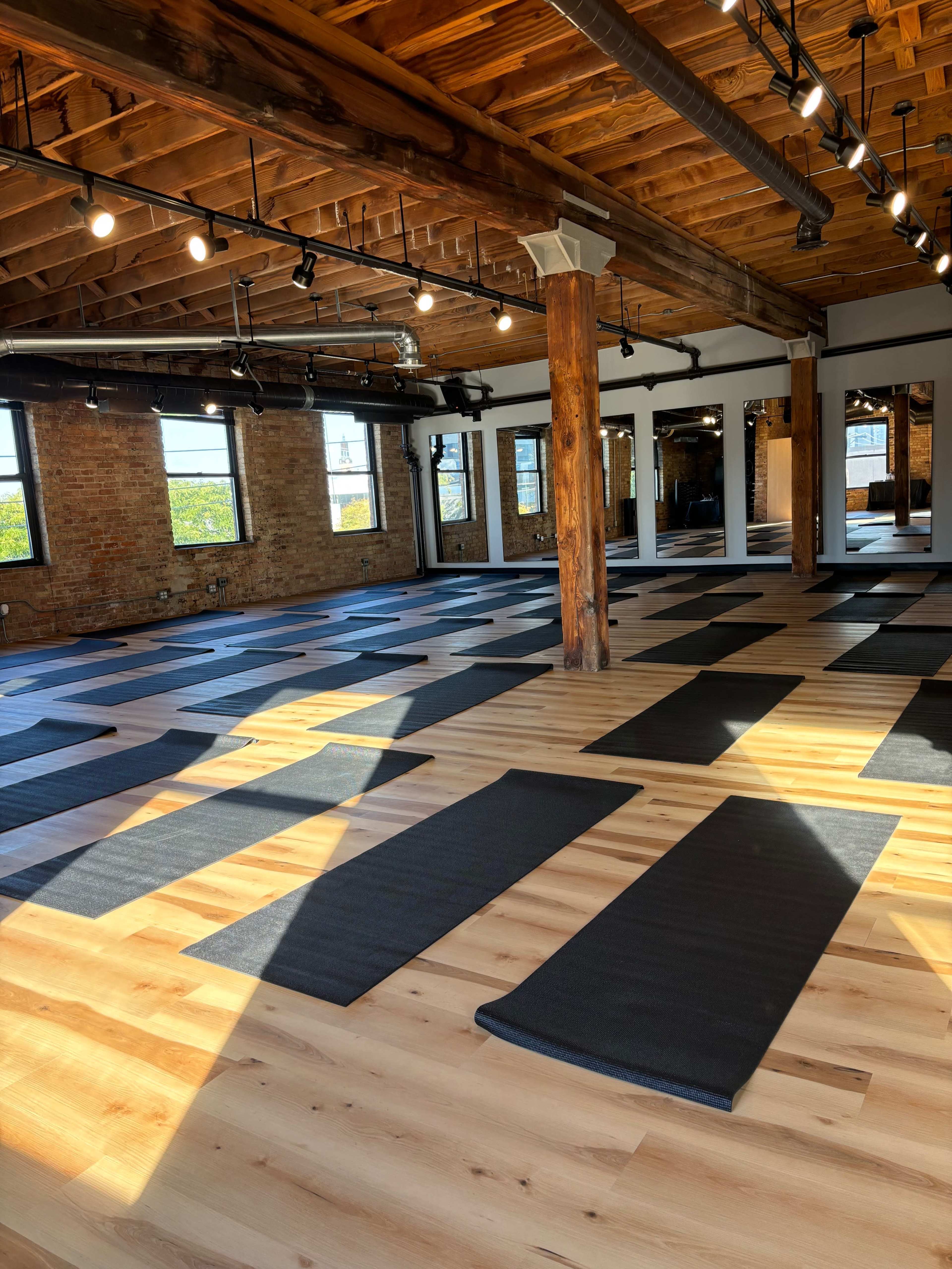 Beautiful timber loft fitness studio with equipment, skyline view and outdoor space. Image in Near North Side, Chicago, IL