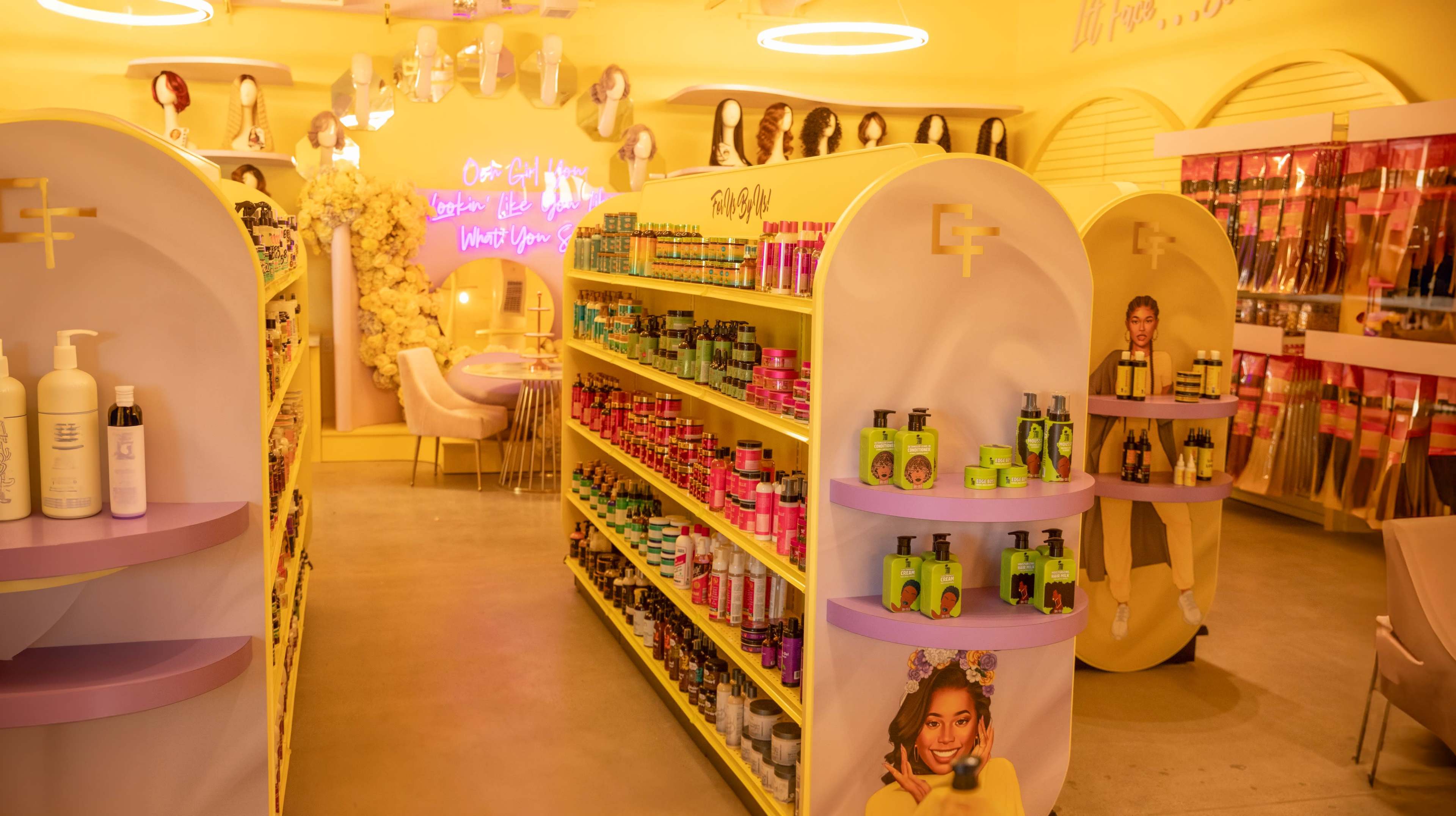 The image shows an interior view of a brightly colored beauty store with shelves stocked with various hair and beauty products.