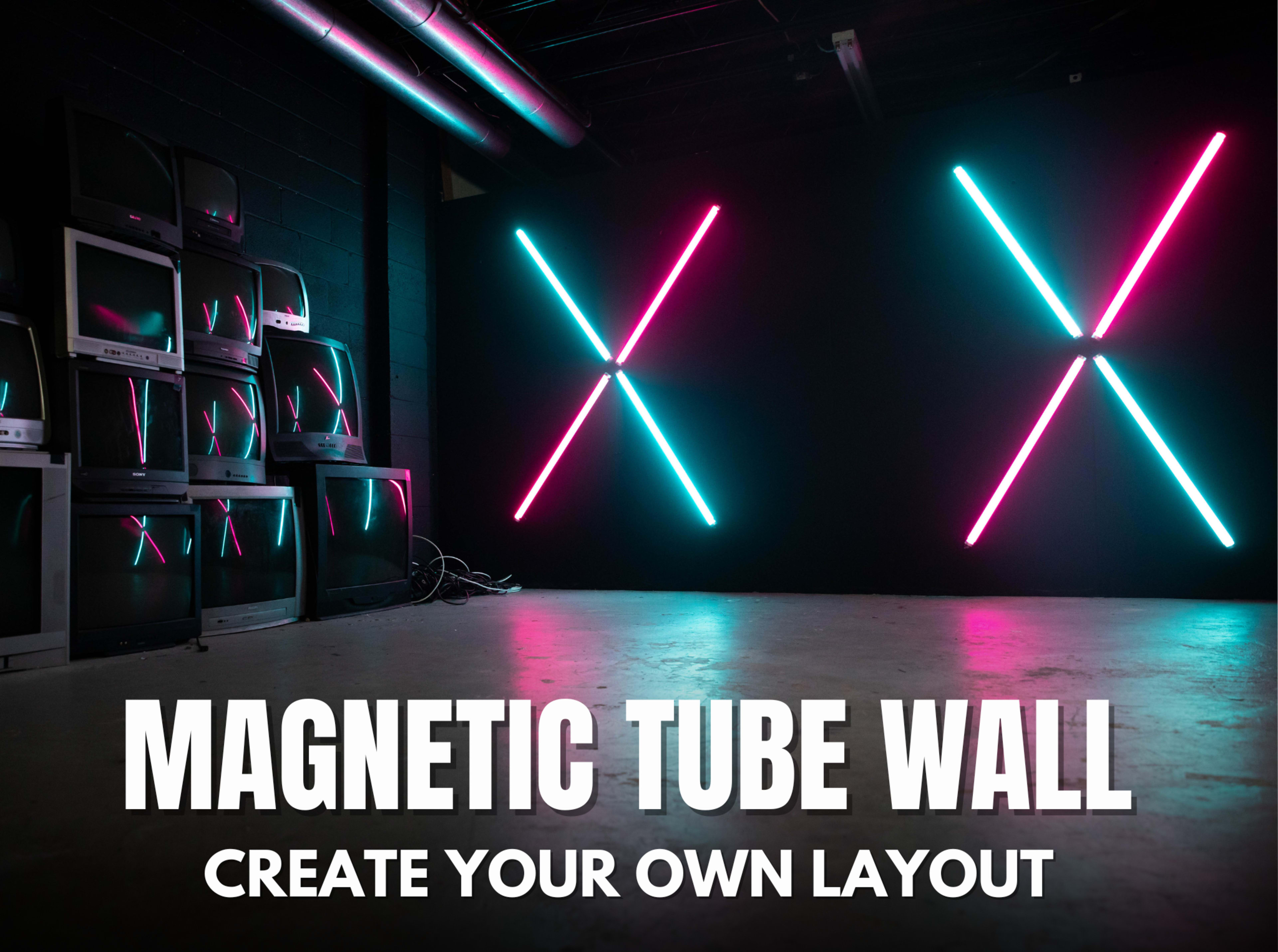 The image shows a dark room featuring a wall with glowing neon tubes arranged in an "X" pattern, alongside a stack of vintage televisions.