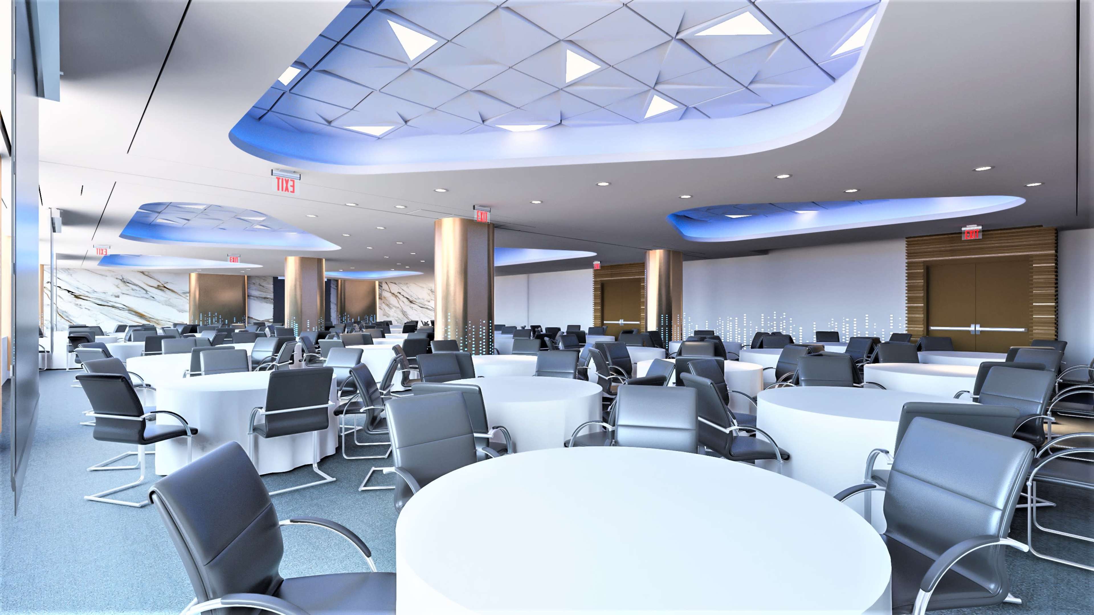 The image shows a modern conference room set up with several round tables and black ergonomic chairs arranged in a spacious layout beneath a unique ceiling design.