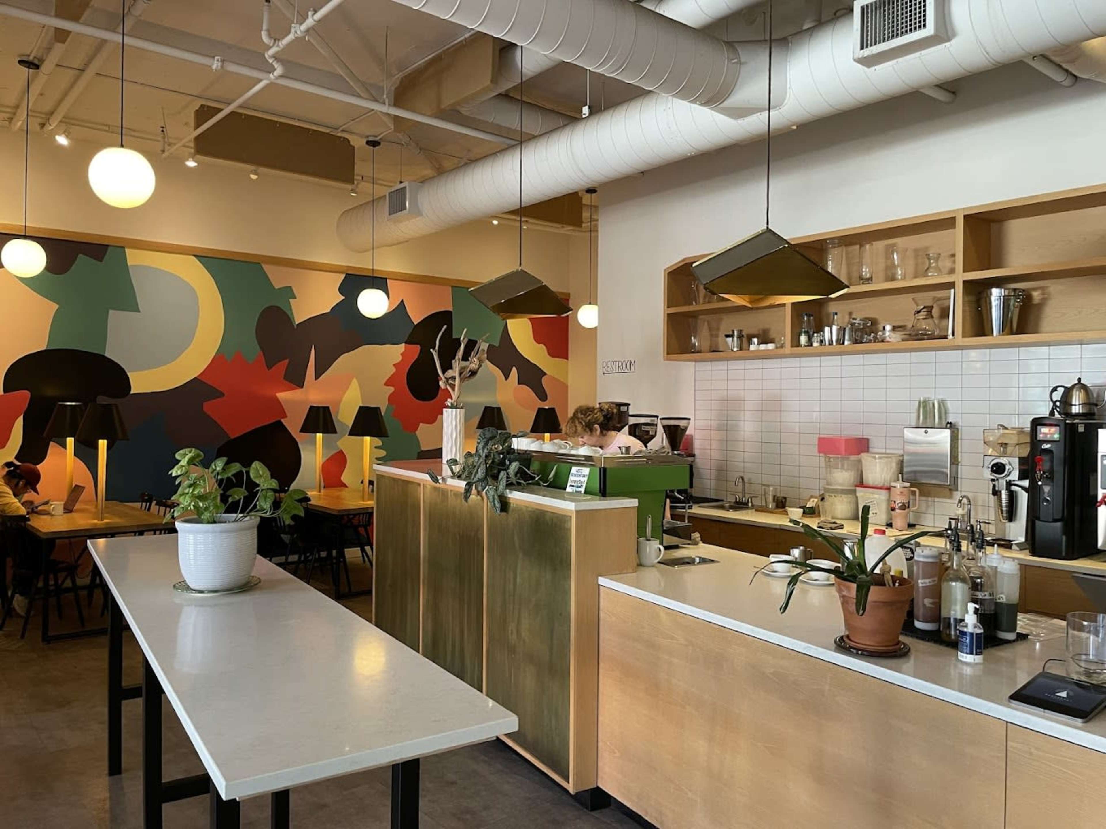 This cafe displays a great mix of a industrial and modern feel to it, making it a perfect place to relax and hangout, whilst also being a great place be productive and get things done. The cafe is located in a diverse area with homes and schools nearby, but it also consists of a city enviornment, along with the light rail being a 2 minute walk away. Lastly, best of all the coffee/staff/community is amazing. Image in Roosevelt, Seattle, WA