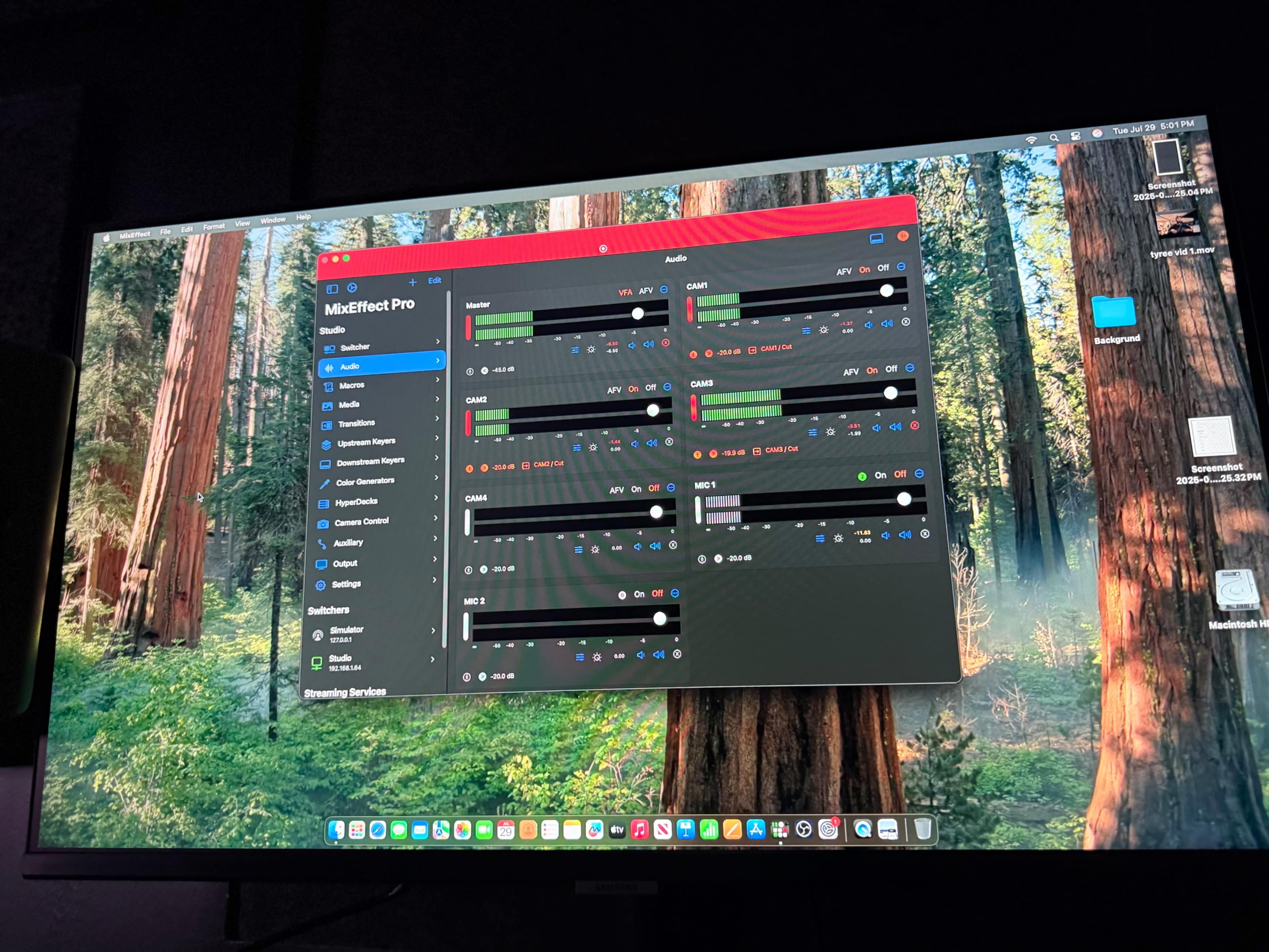 The image shows a computer screen displaying the Mi Effects Pro software interface over a background of tall trees in a forest.