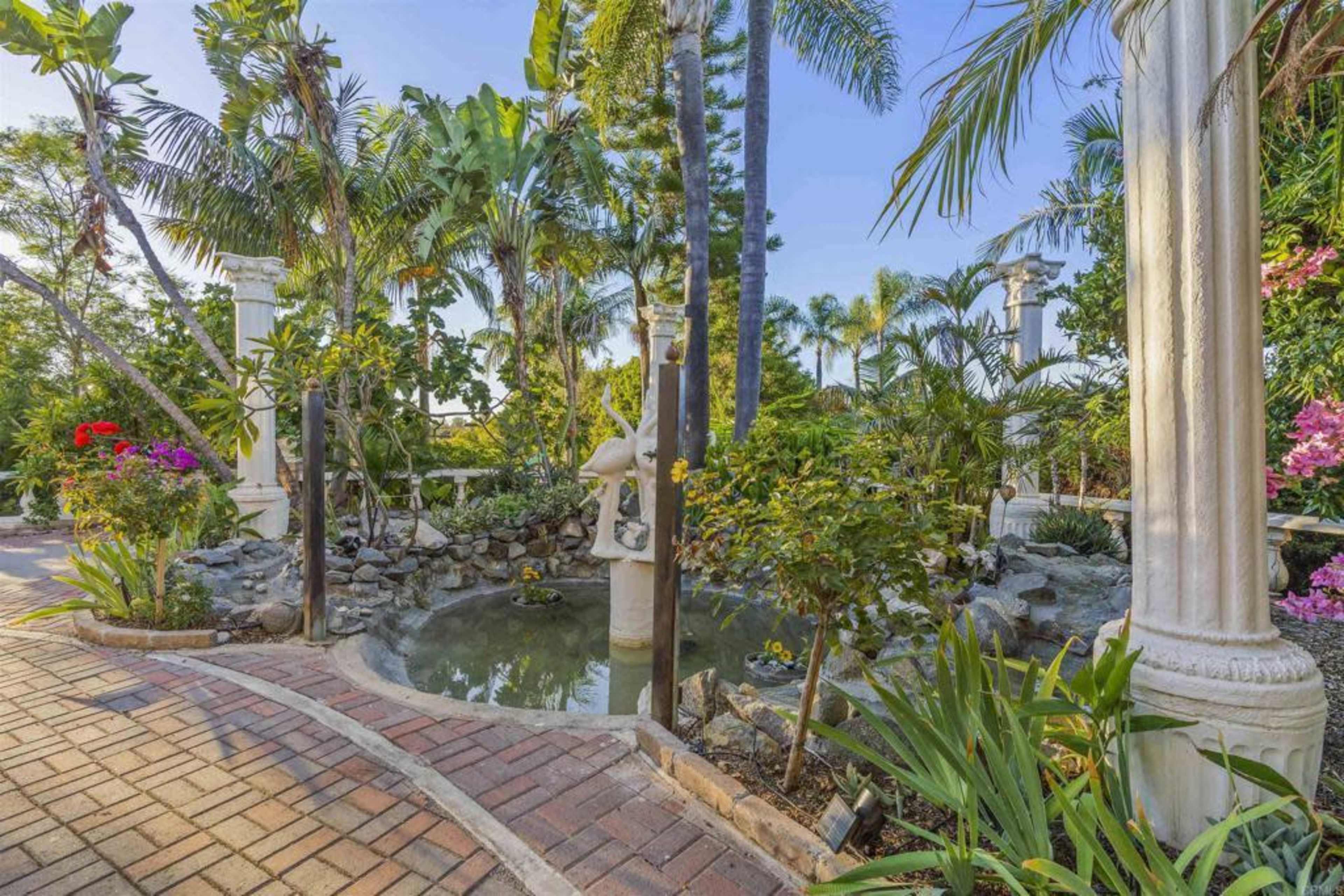 Elegant Outdoor Oasis with Lush Gardens, Pool, and Patios—Perfect for Daytime Events in Vista Image in , Vista, CA