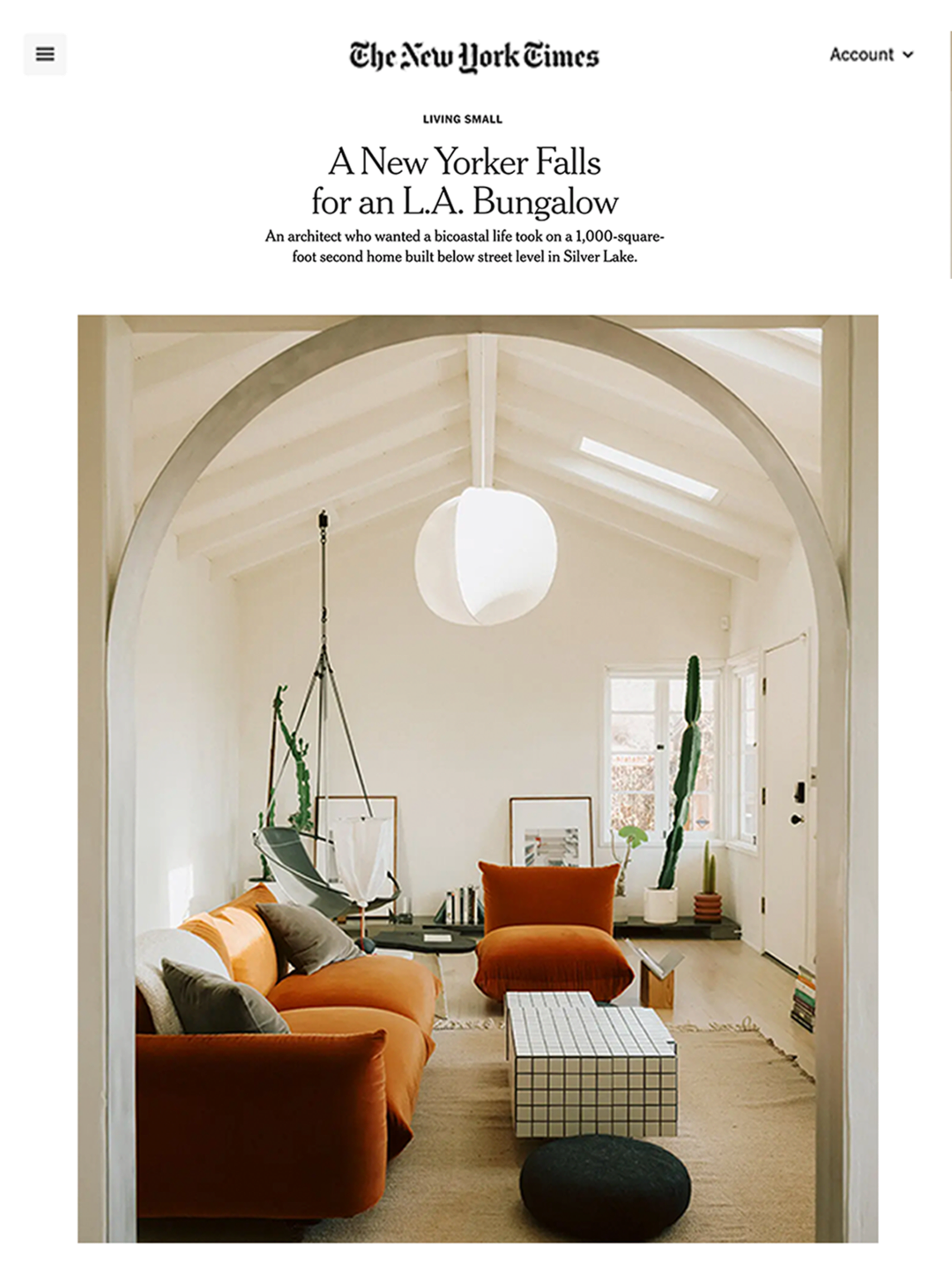 The image shows a light-filled living room with a white ceiling, orange and gray furniture, and a hanging swing chair, framed by an archway.