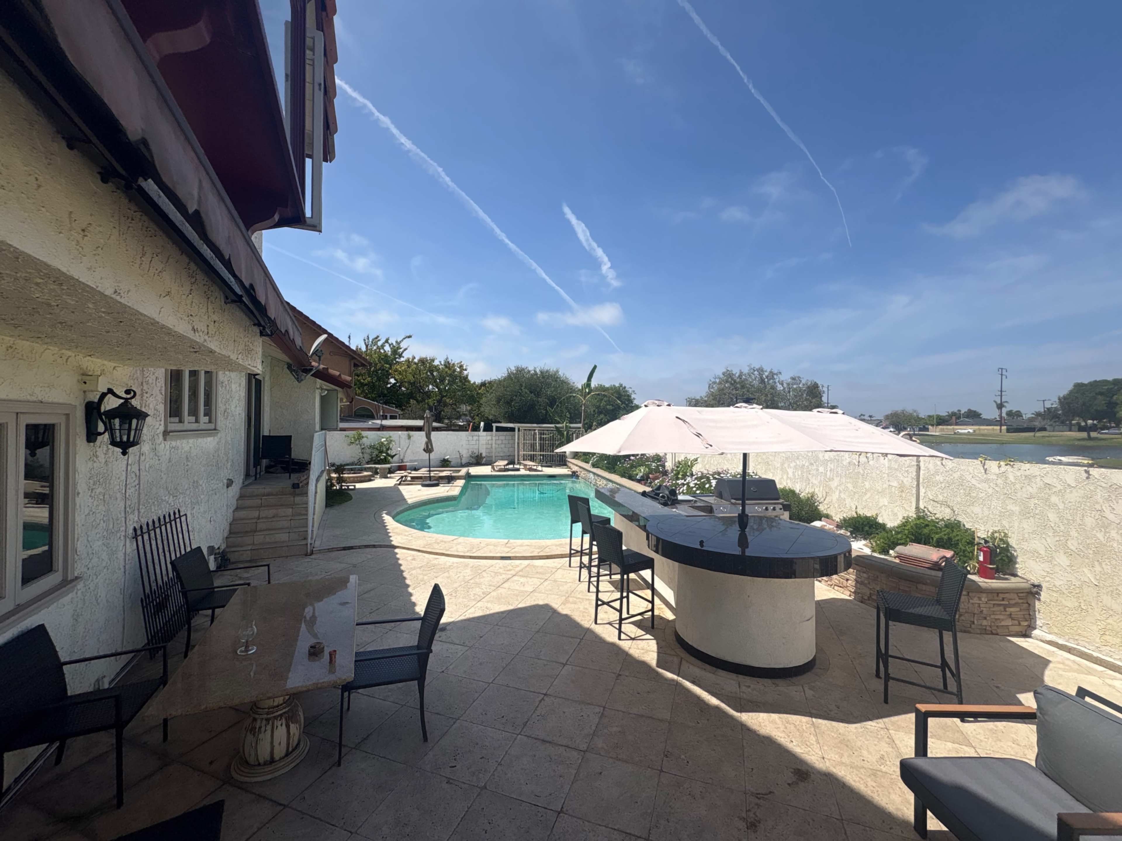 Beautiful home lactated 10 min from beach 5 Bedrooms 3 Full bathrooms and pool and hot tub in backyard Image in Huntington Beach, Huntington Beach, CA