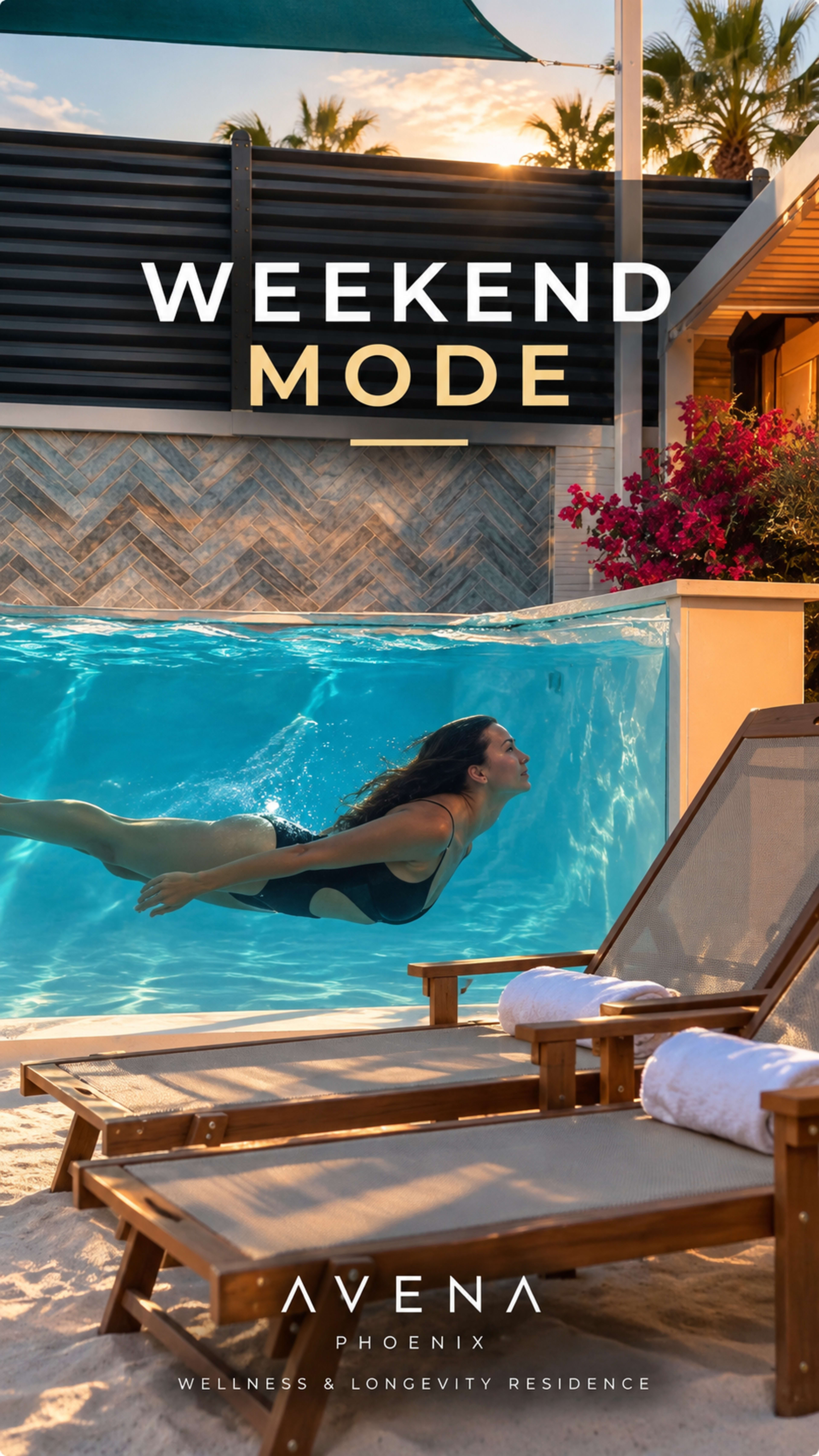 A person swims in a clear pool surrounded by sun loungers and tropical plants at a wellness residence.