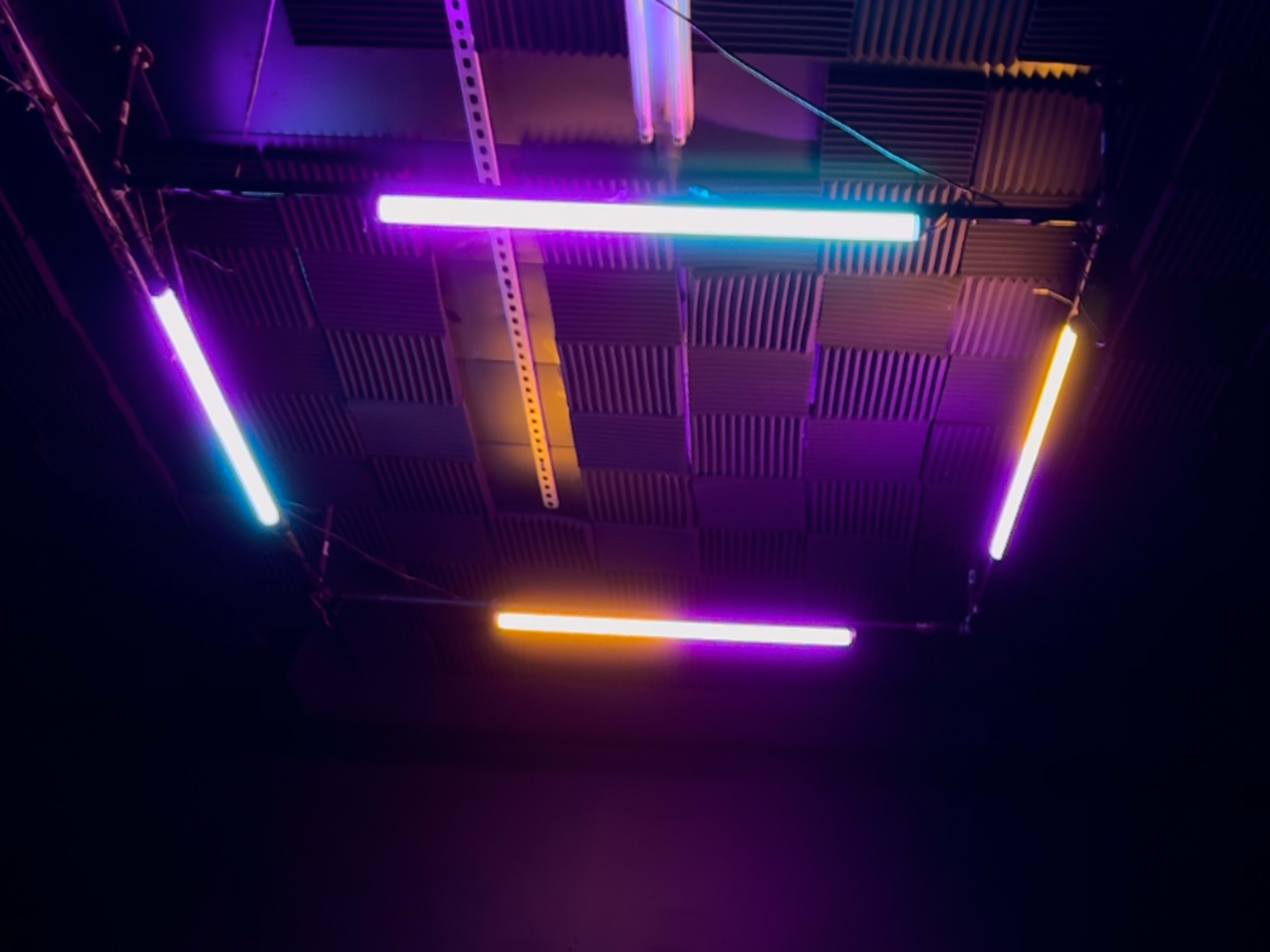 Astera Titan Overhead Lights over Black Room