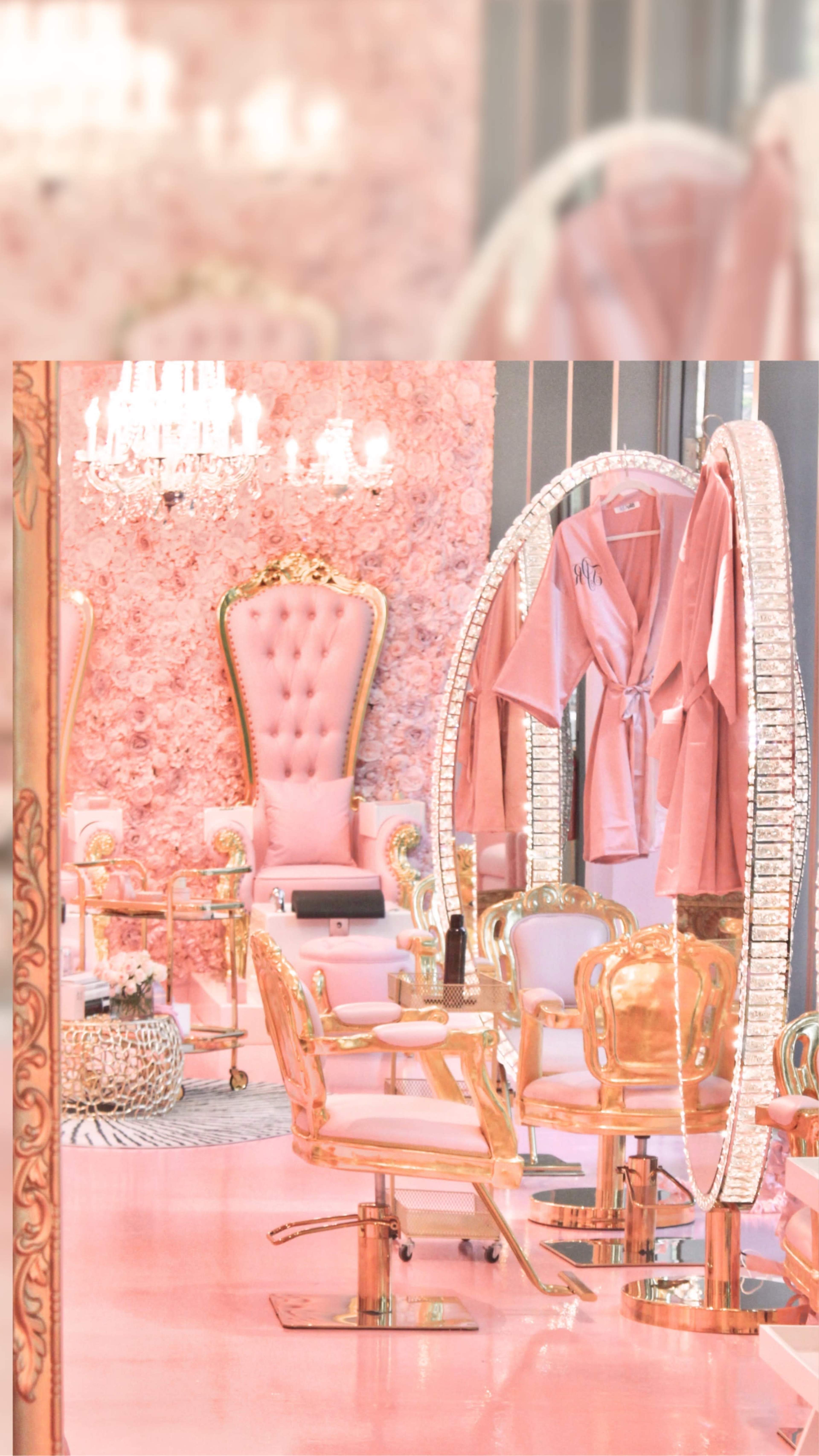The image features a luxurious beauty salon adorned with pink walls, golden furniture, and elegant decor.